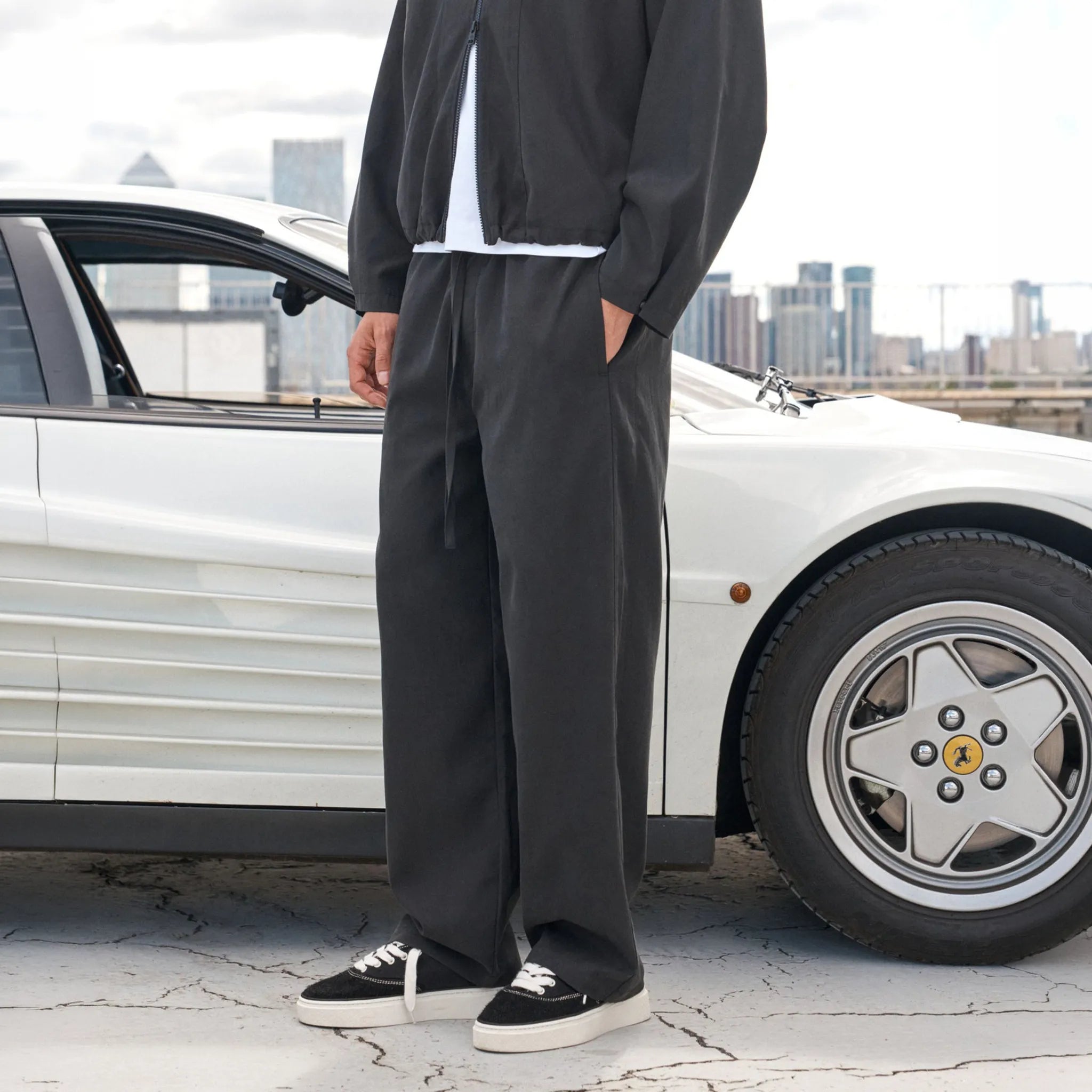 Front Side View of The Couture Cupro Panelled Black Trousers