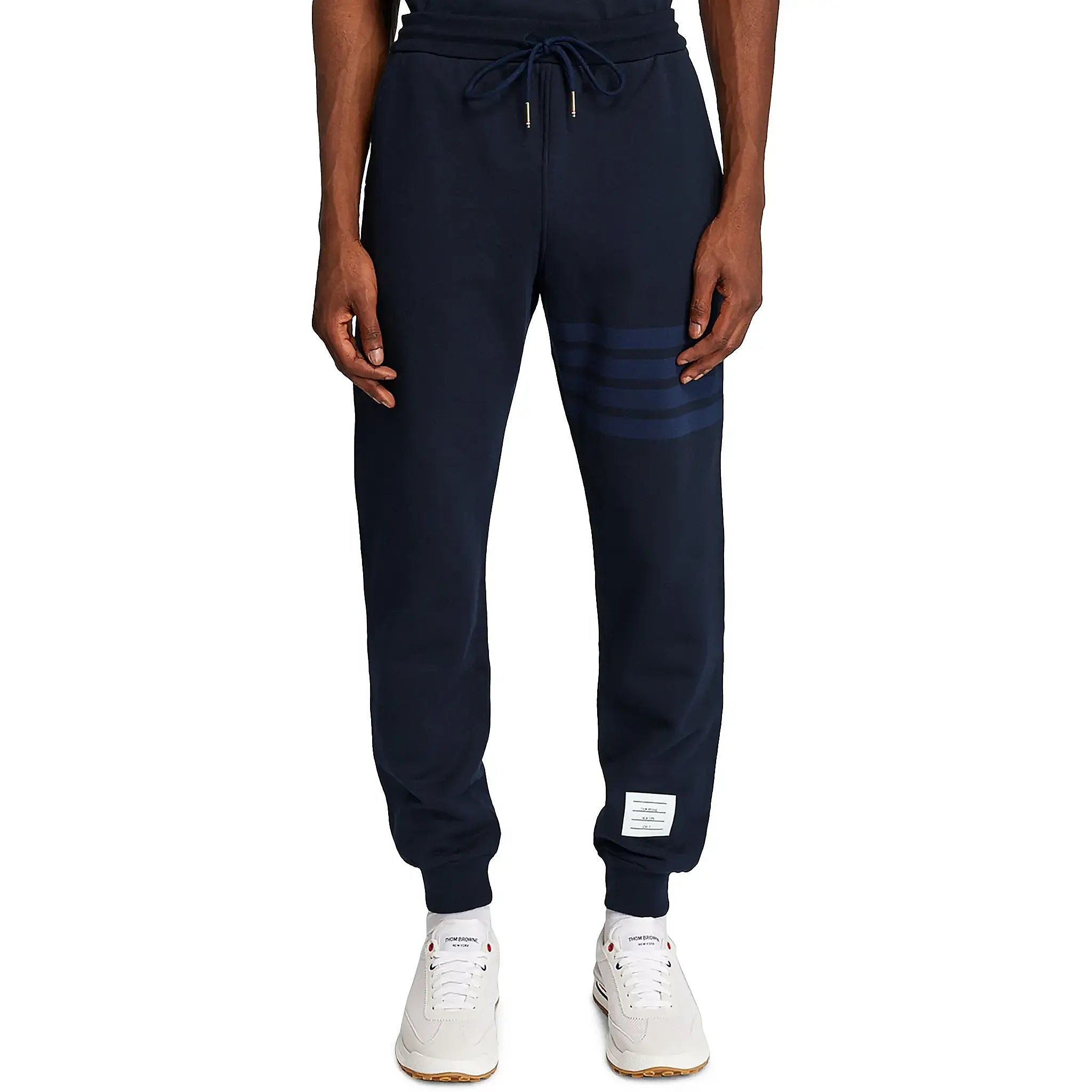 Model front view of Thom Browne Classic Loopback 4-Bar Blue Sweatpants MJQ008A-06910-415