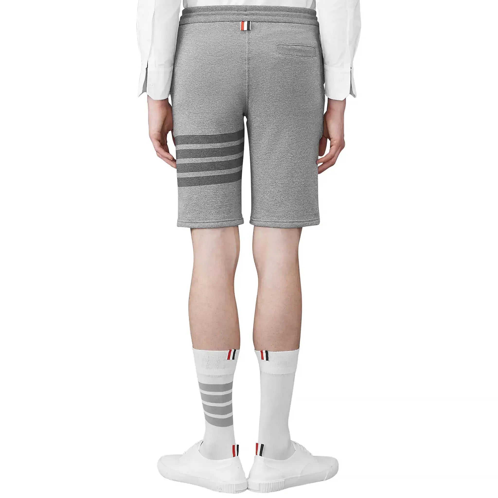 Model back view of Thom Browne Classic Loopback 4-Bar Grey Sweat Shorts MJQ012H-00535
-068