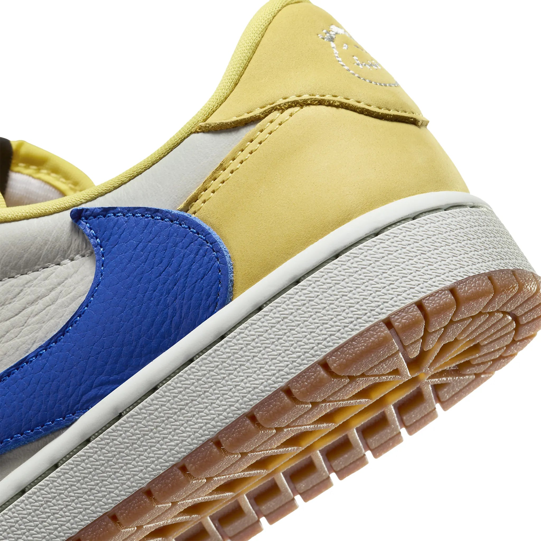 Detail view of Travis Scott x Air Jordan 1 Retro Low OG Canary (W) DZ4137-700