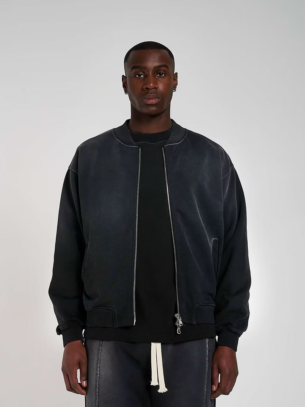 Model view of Kaizen Market Blank Heavyweight Fade Out Black Bomber Jacket