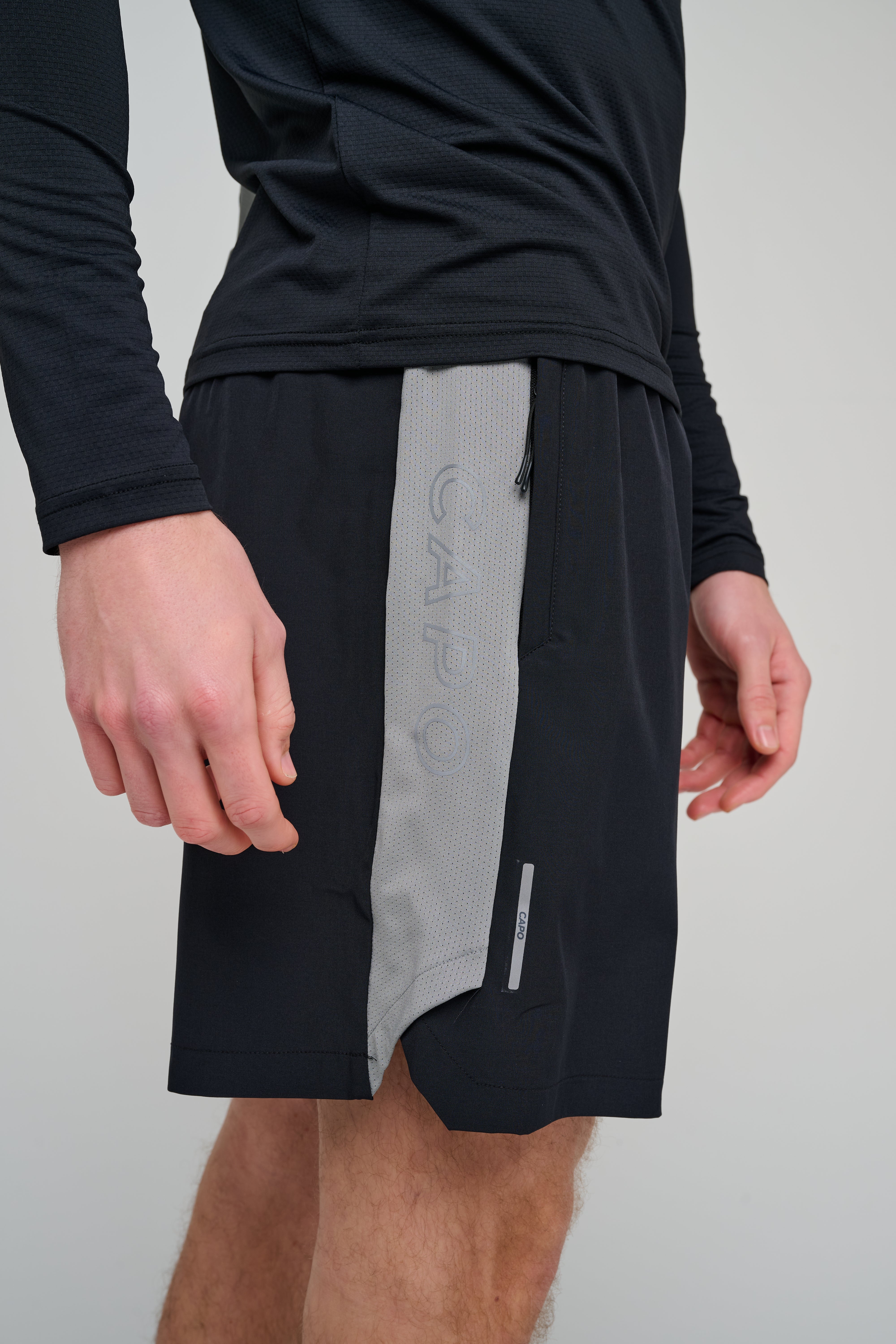 Side view of CAPO Active Performance Black Shorts
