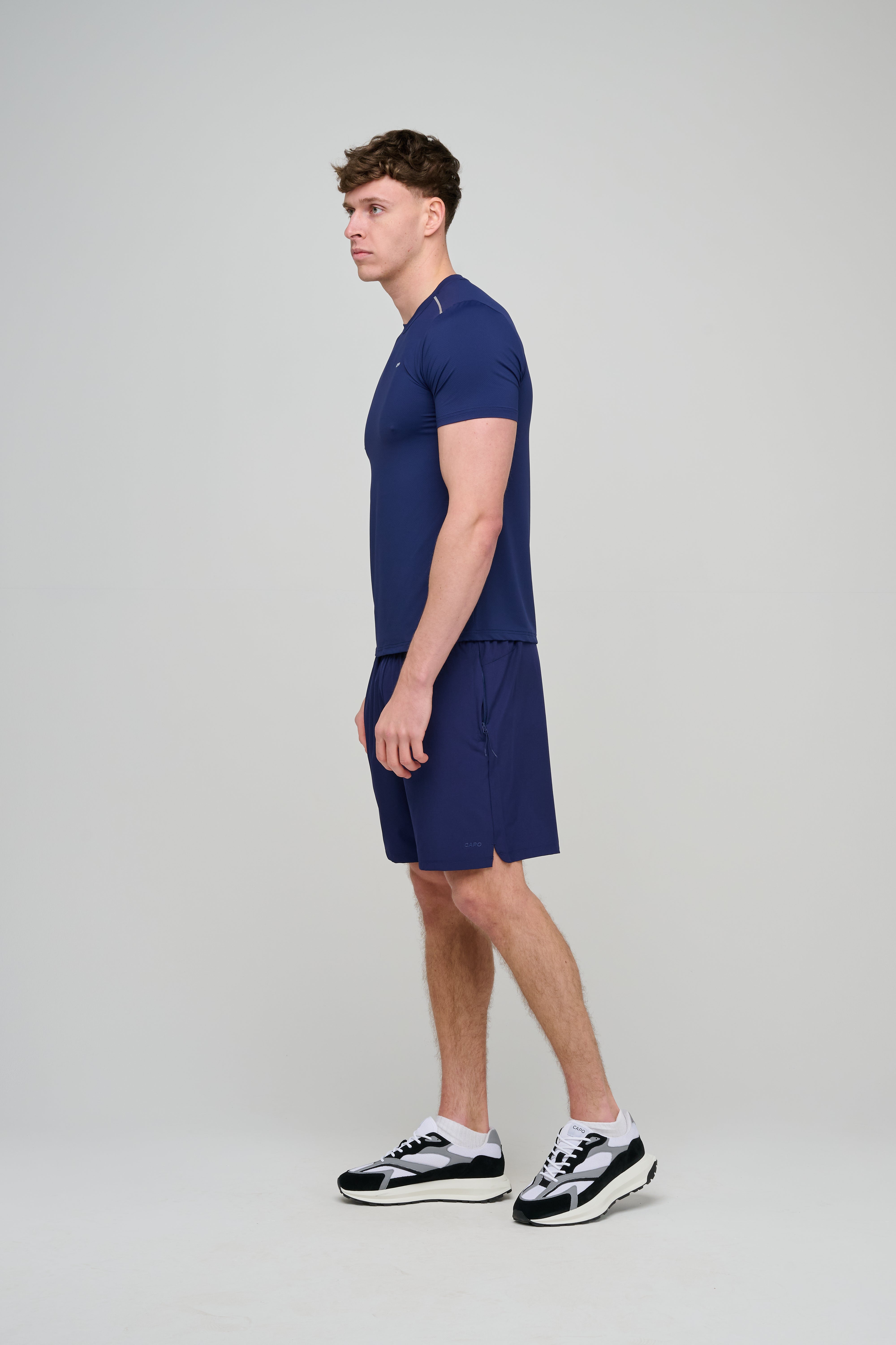 Side view of CAPO Active Core Navy Shorts
