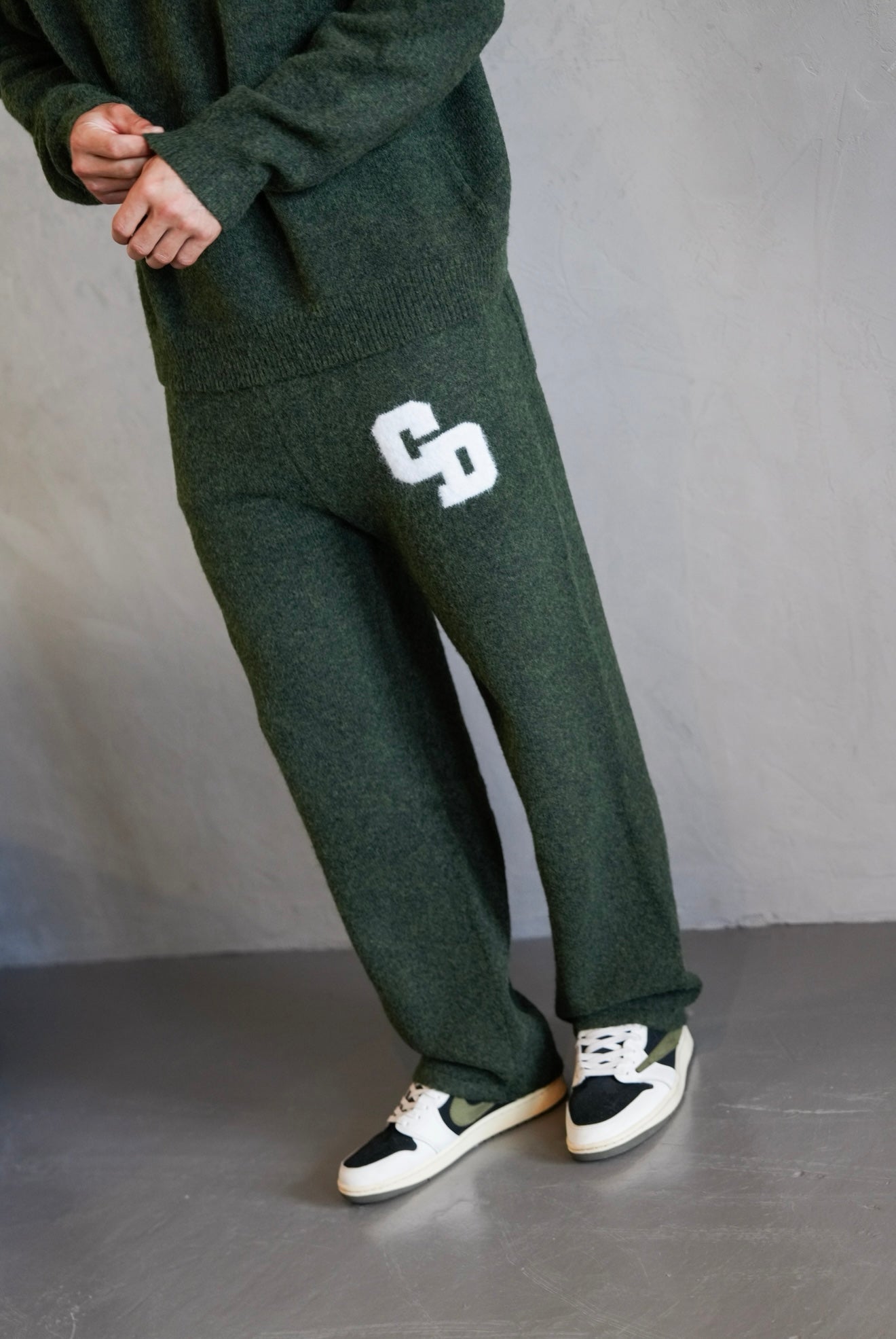 Model view of Cardair CD Logo Knit Olive Sweatpants