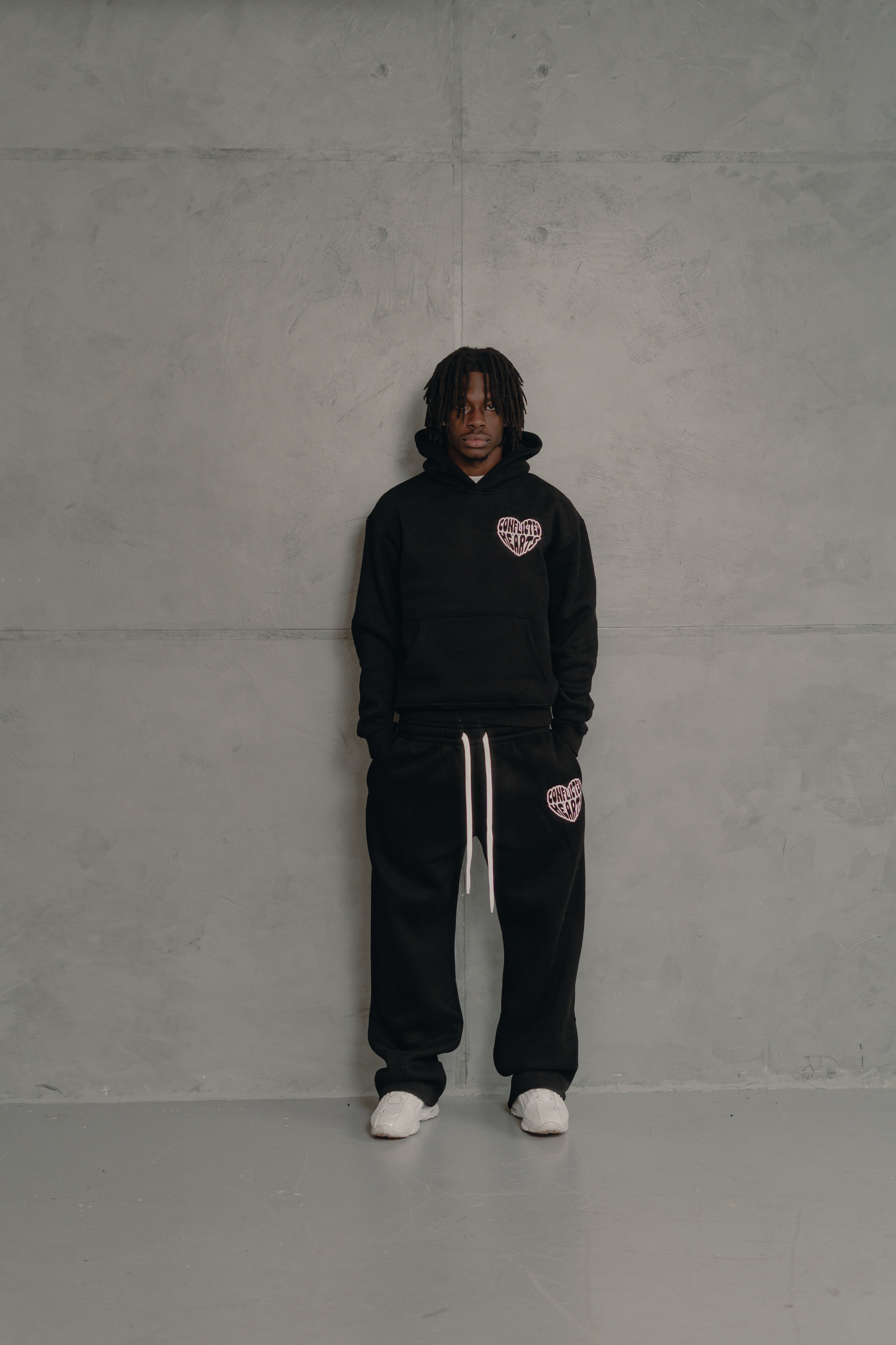 Model view of Conflicted Hearts Basics Black Sweatpants
