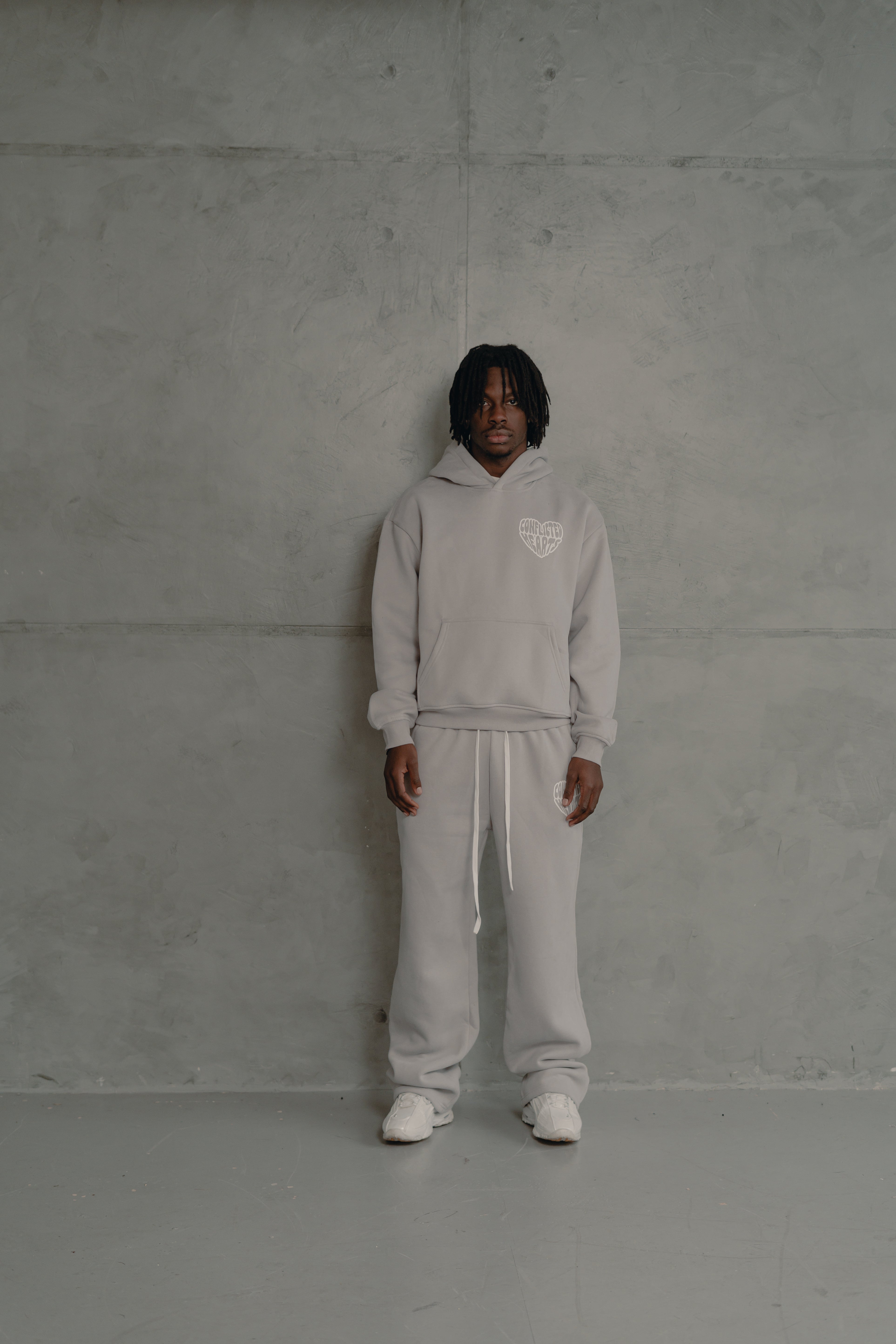 Model view of Conflicted Hearts Basics Grey Sweatpants