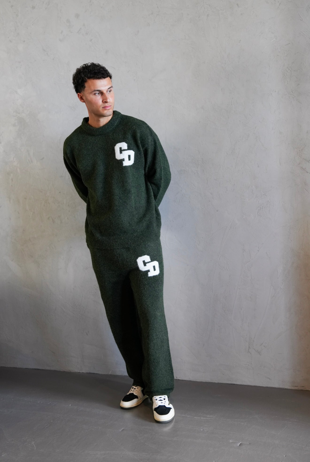Model view of Cardair CD Logo Knit Olive Sweatshirt