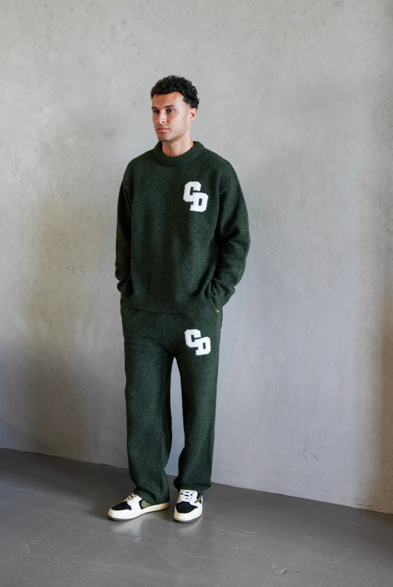 Model view of Cardair CD Logo Knit Olive Sweatpants