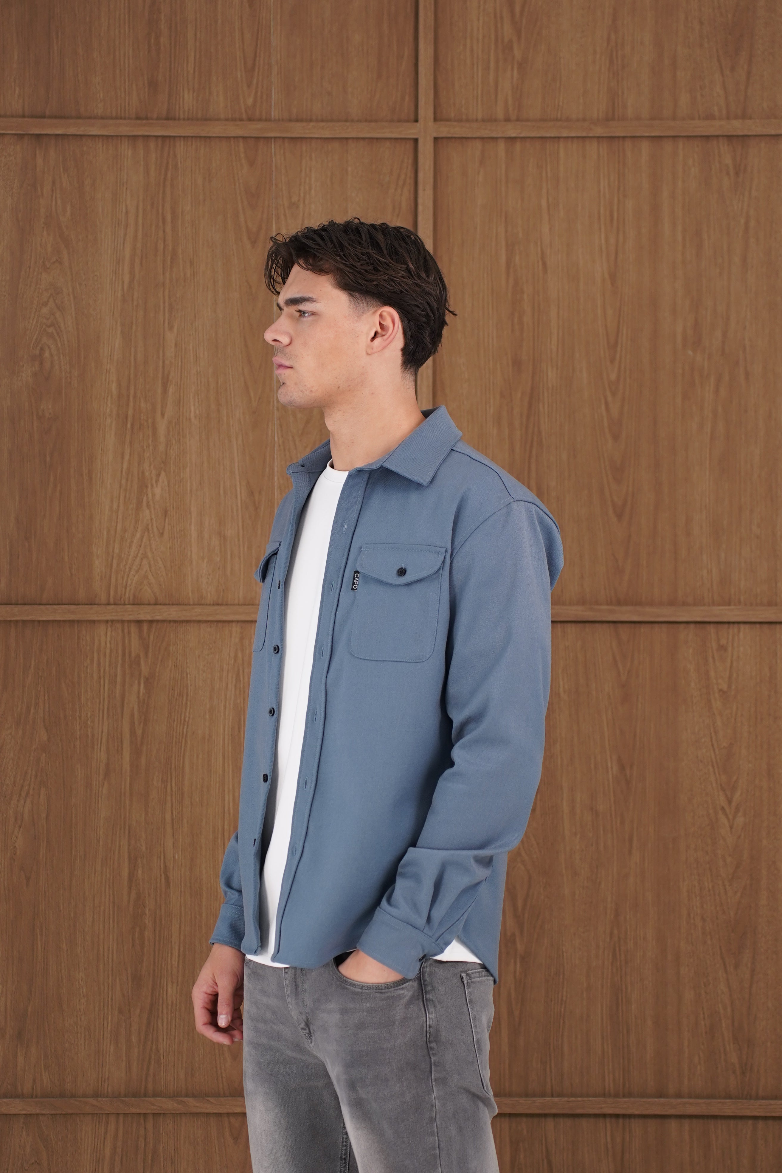 Model side view of CAPO Steel Blue Overshirt