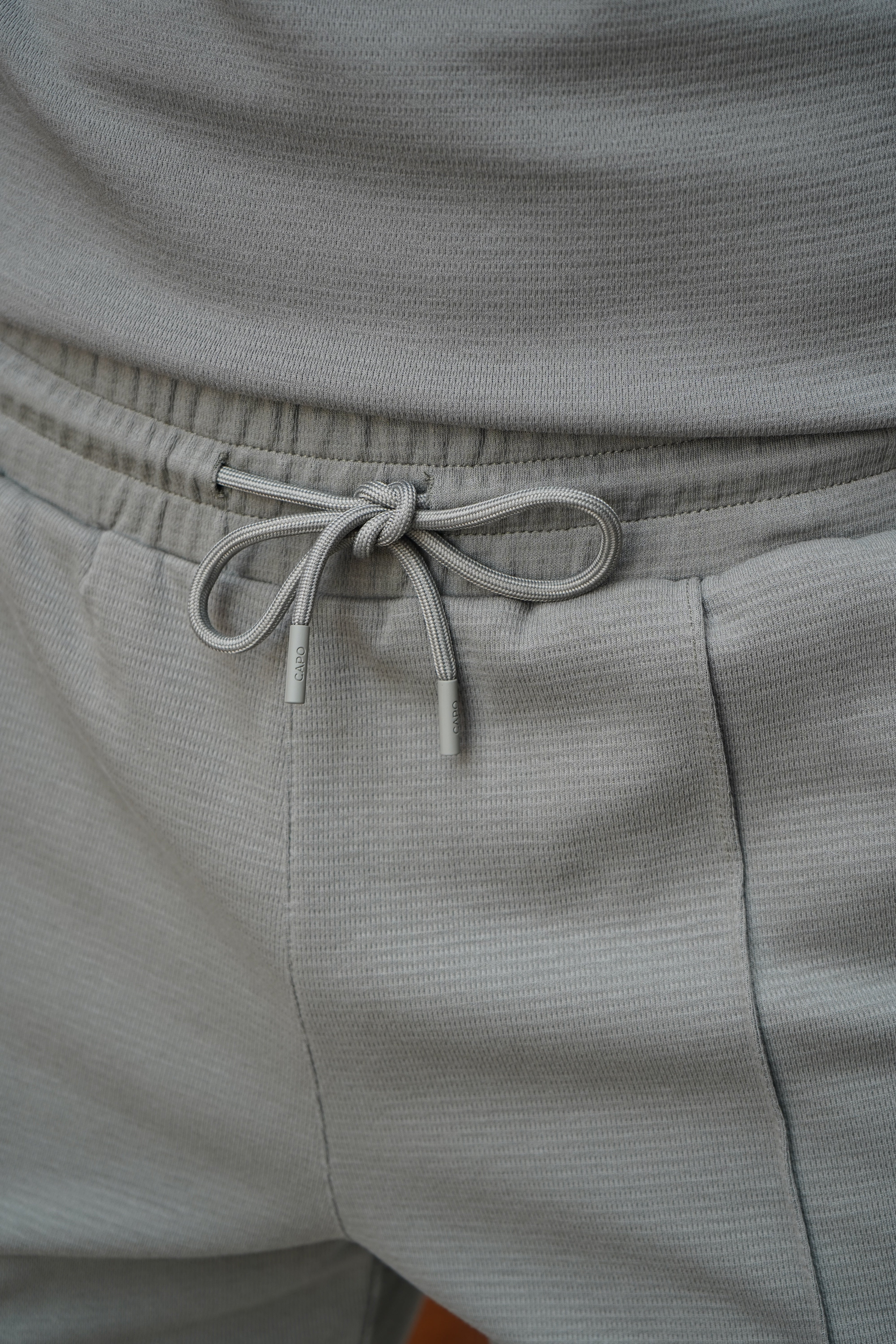 Detail view of textured Light Olive Shorts