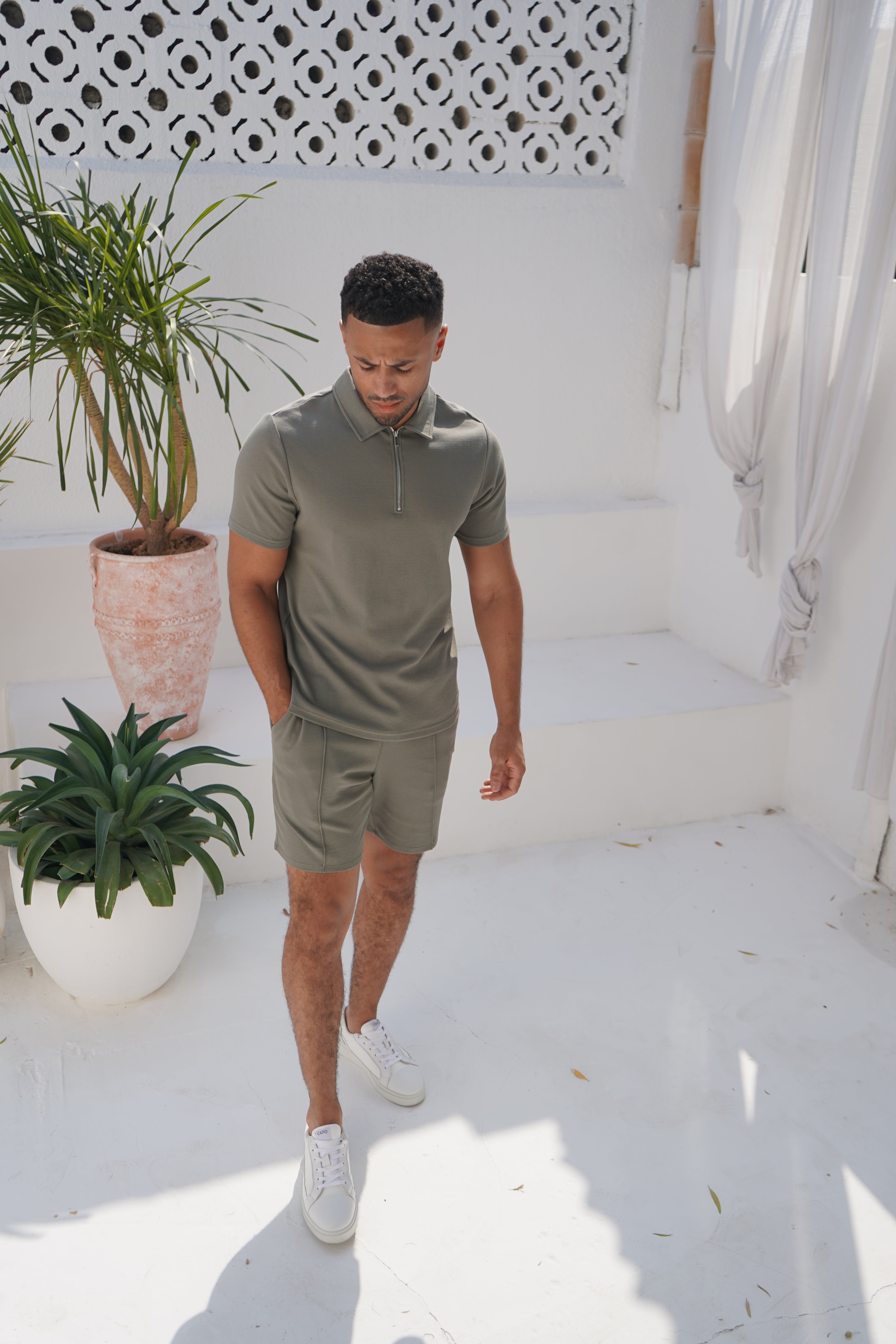 Model view of textured Light Olive Shorts