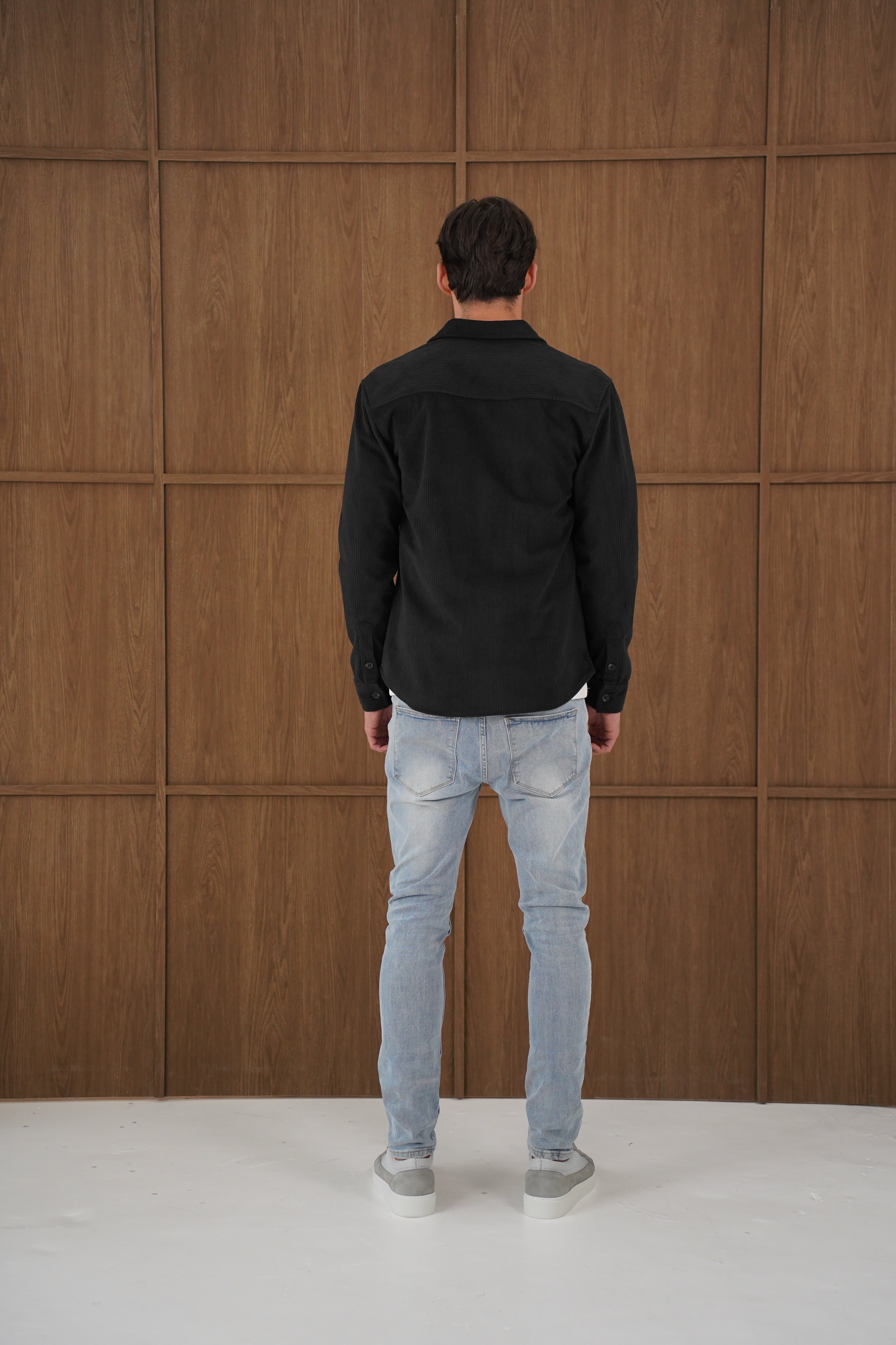 Model back view of CAPO Corduroy Black Overshirt