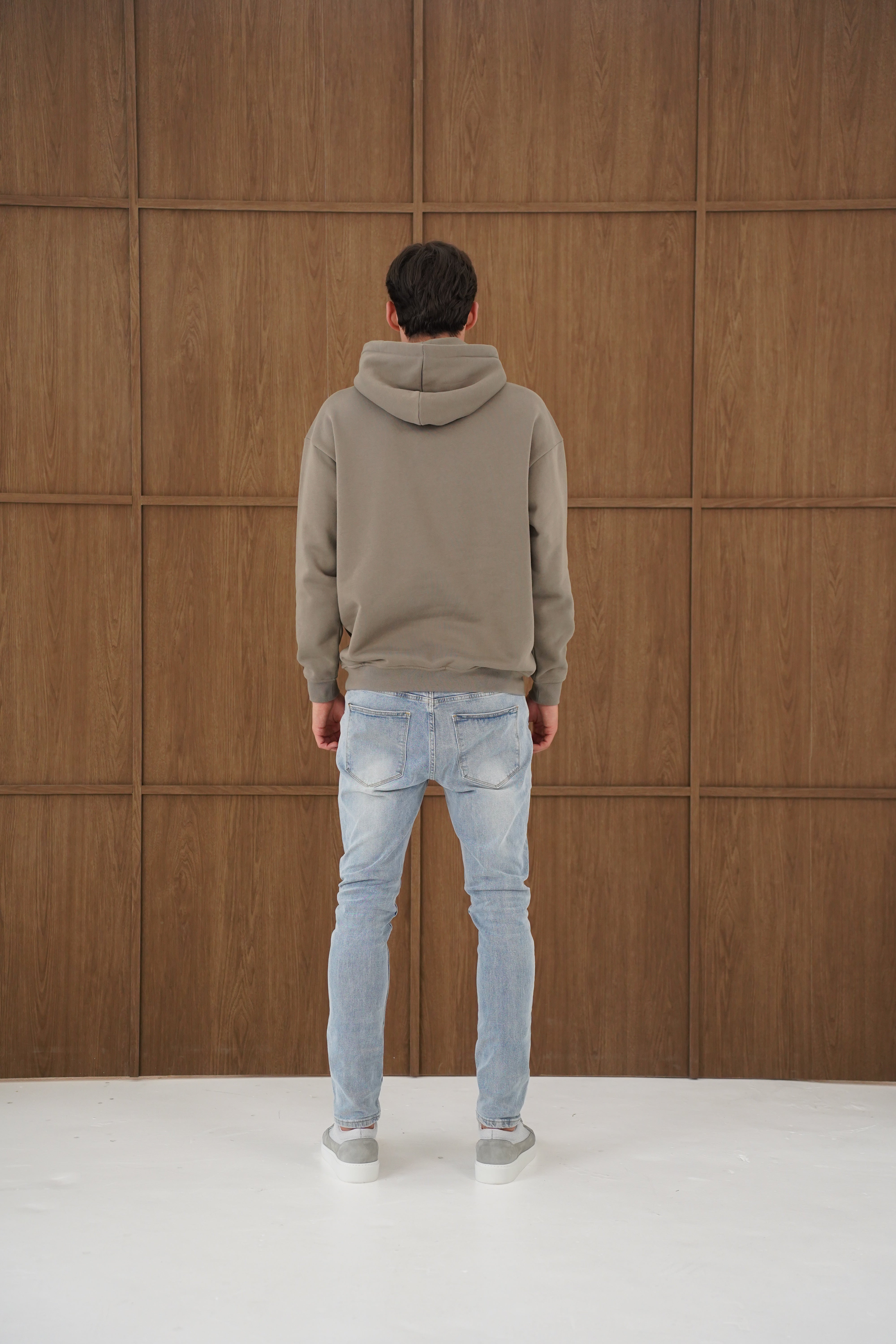 Model back view of CAPO Tracksuit Overhead Olive Hoodie