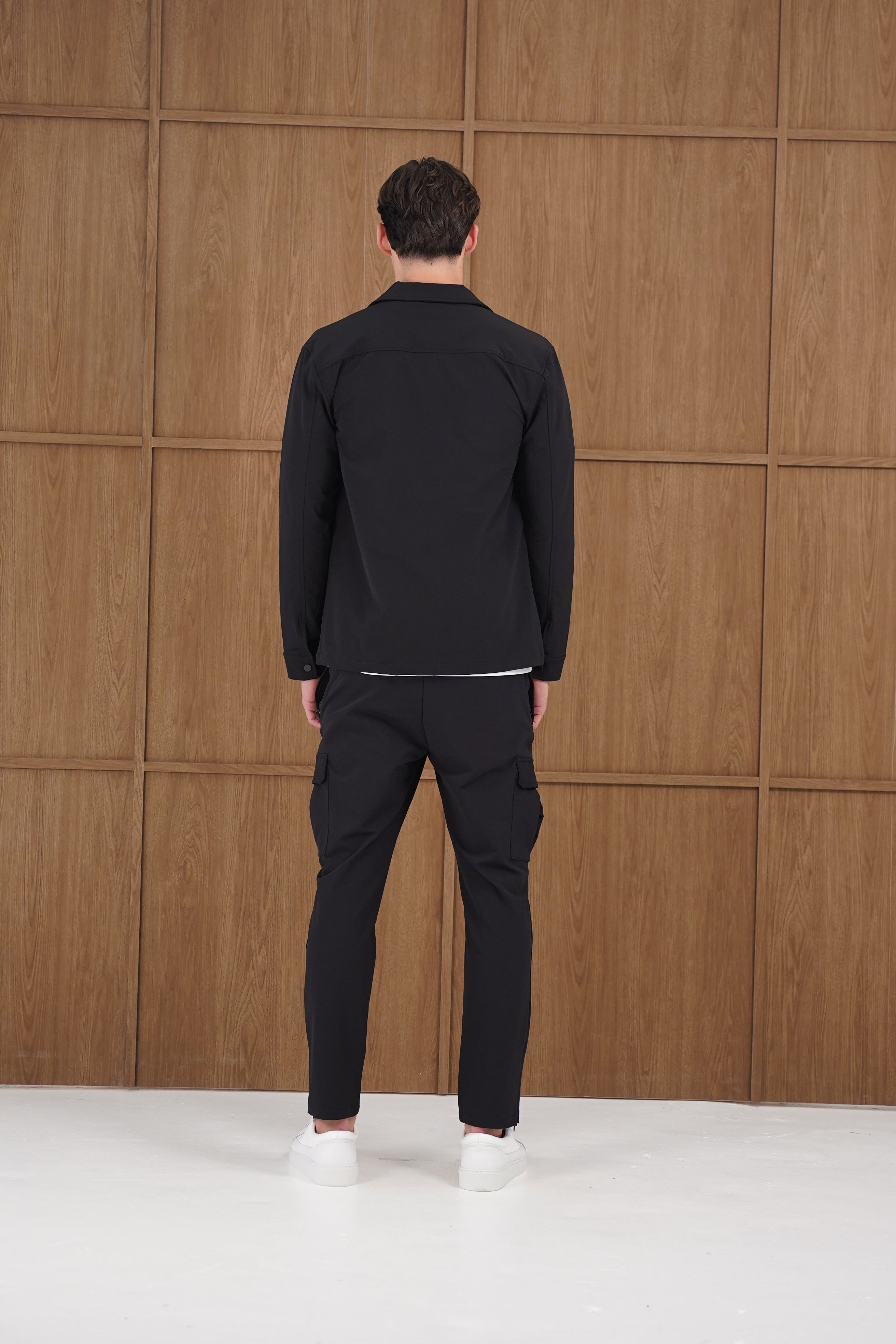 Model back view of CAPO Utility Black Overshirt