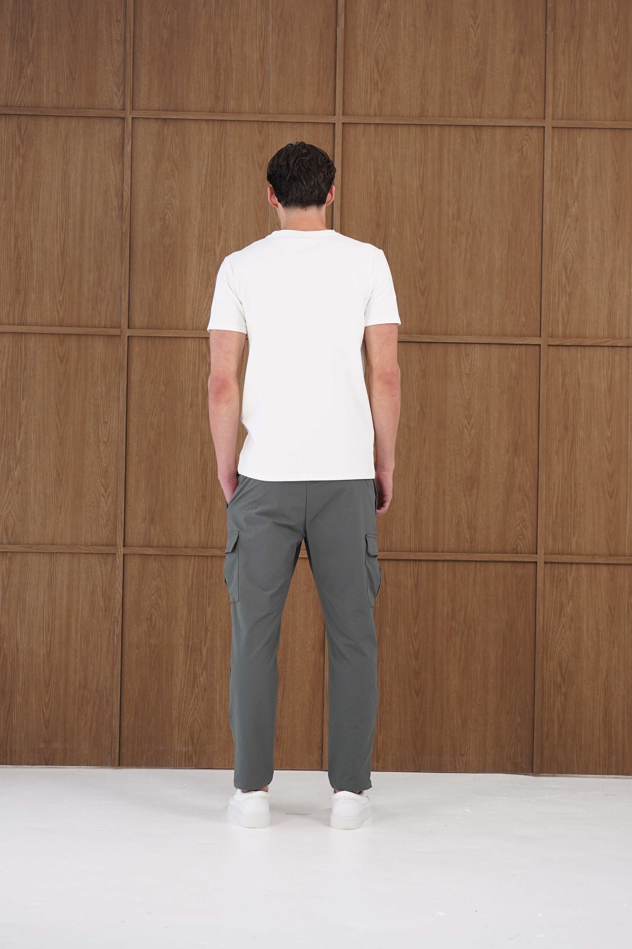 Model back view of CAPO Utility Regular Charcoal Cargo Pants