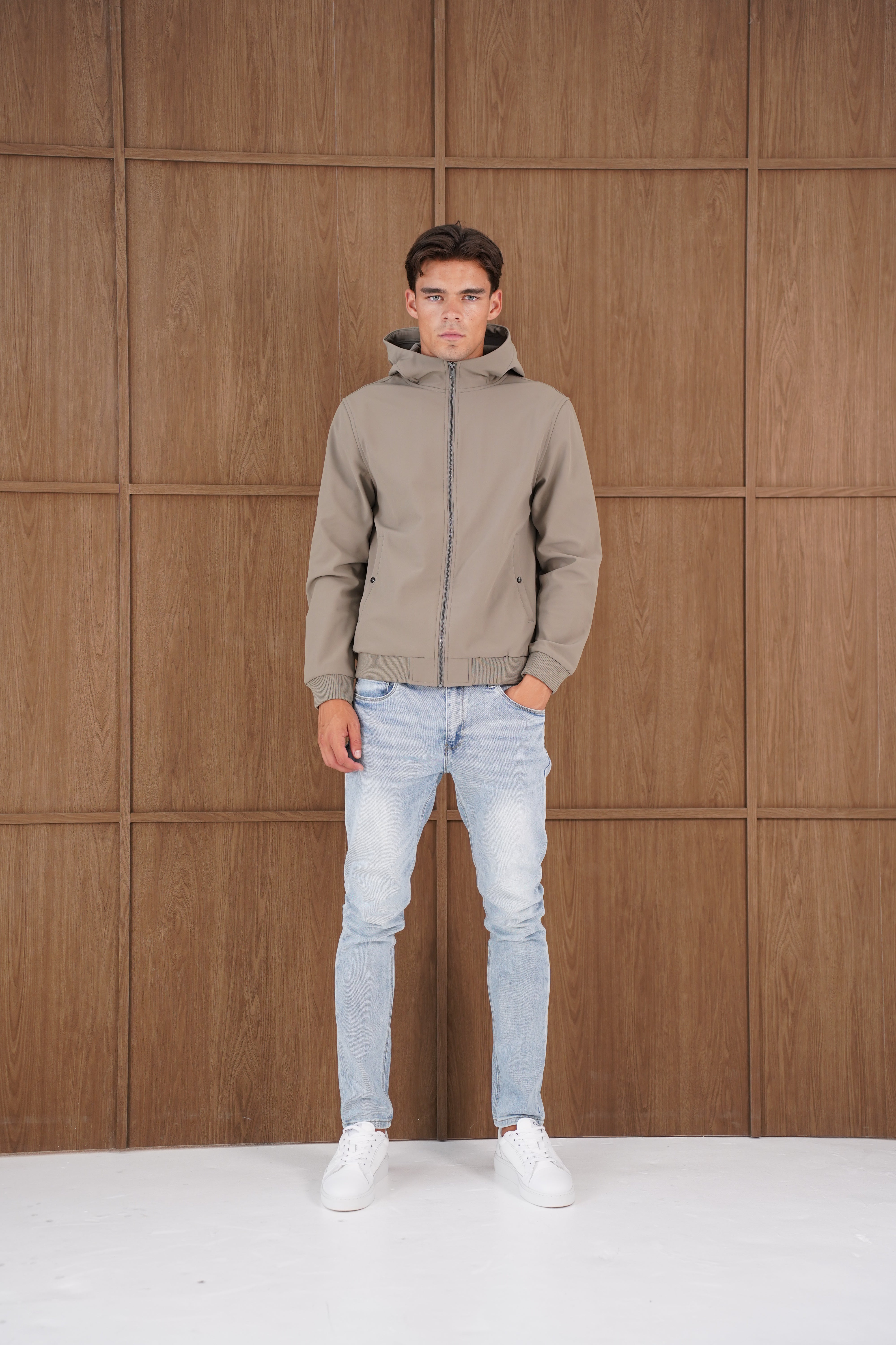 Model view of CAPO Soft Shell Hood Olive Jacket
