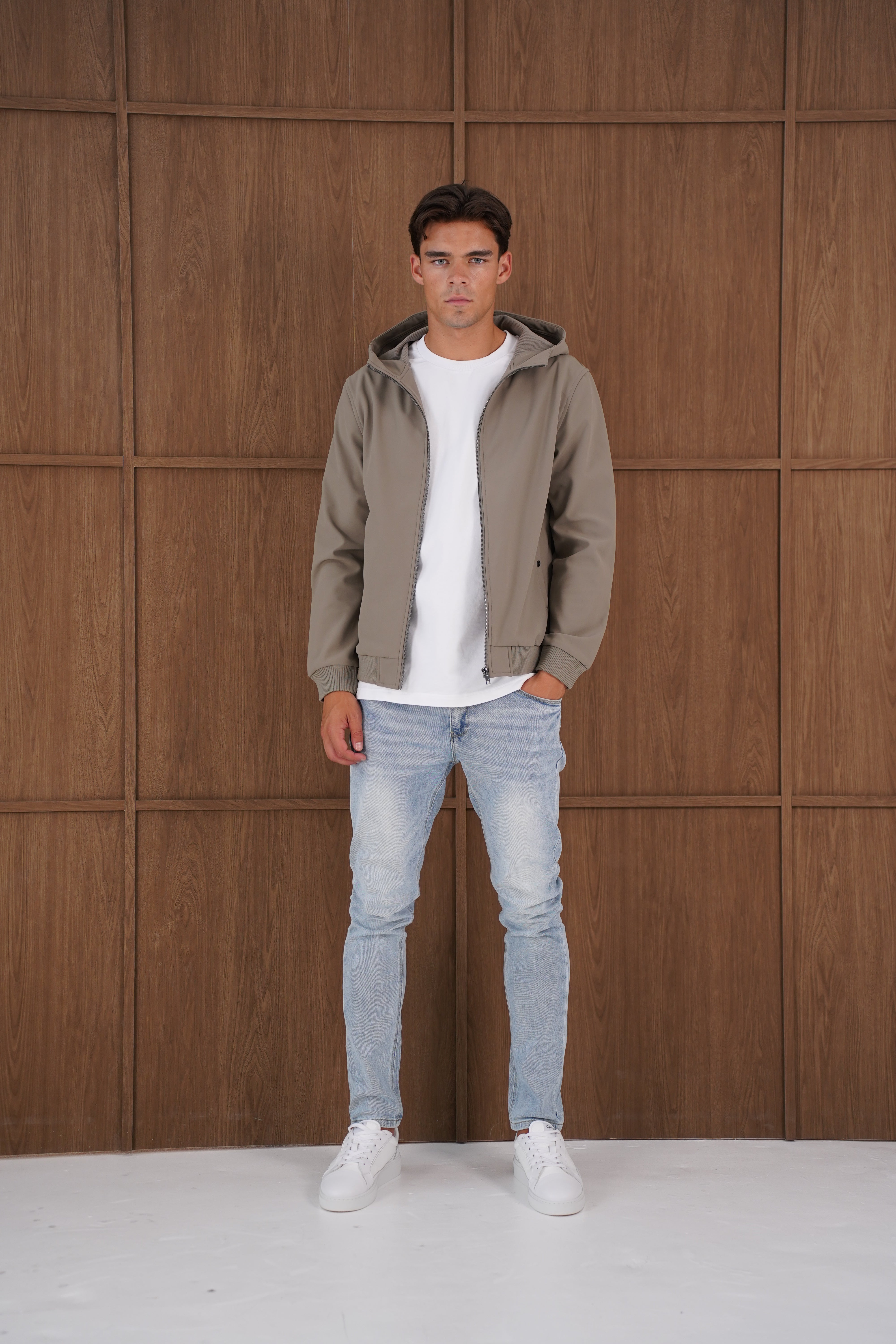 Model view of CAPO Soft Shell Hood Olive Jacket