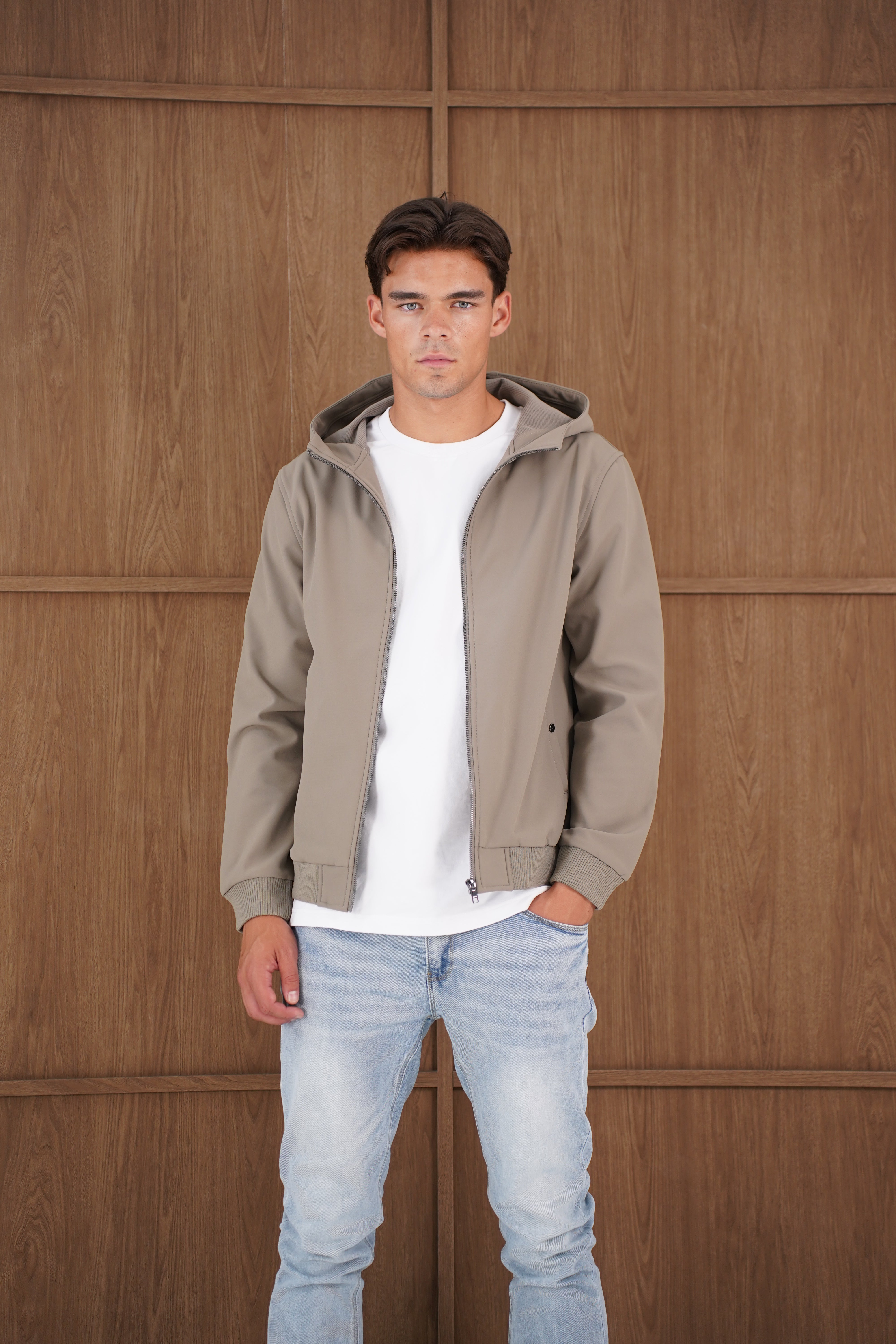 Model view of CAPO Soft Shell Hood Olive Jacket