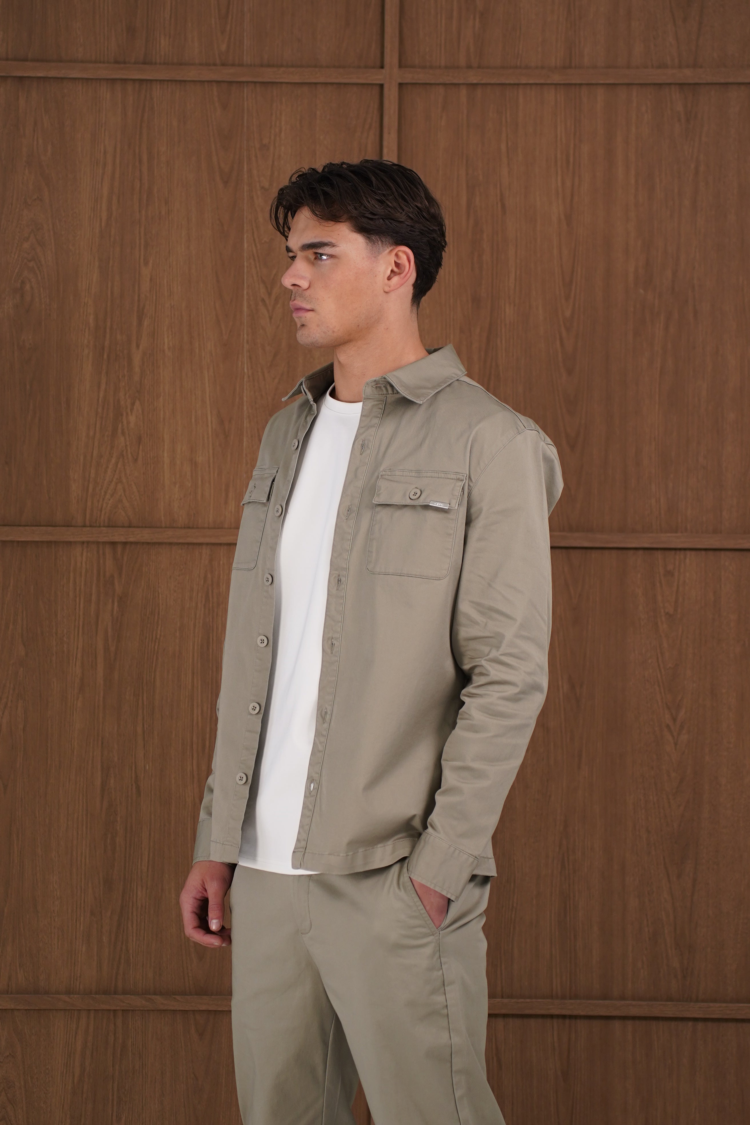 Model side view of CAPO Cotton Cargo Olive Overshirt