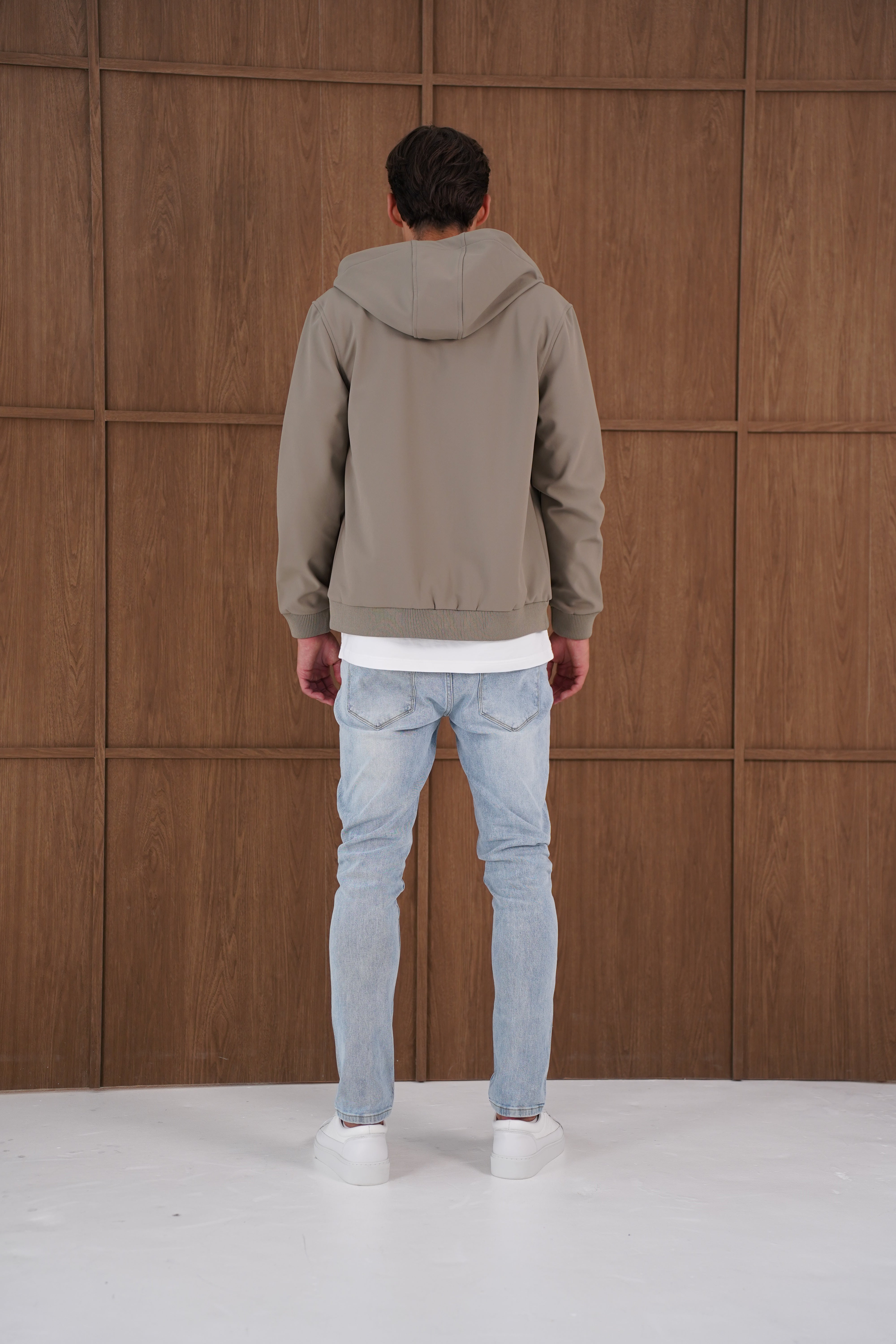 Model back view of CAPO Soft Shell Hood Olive Jacket