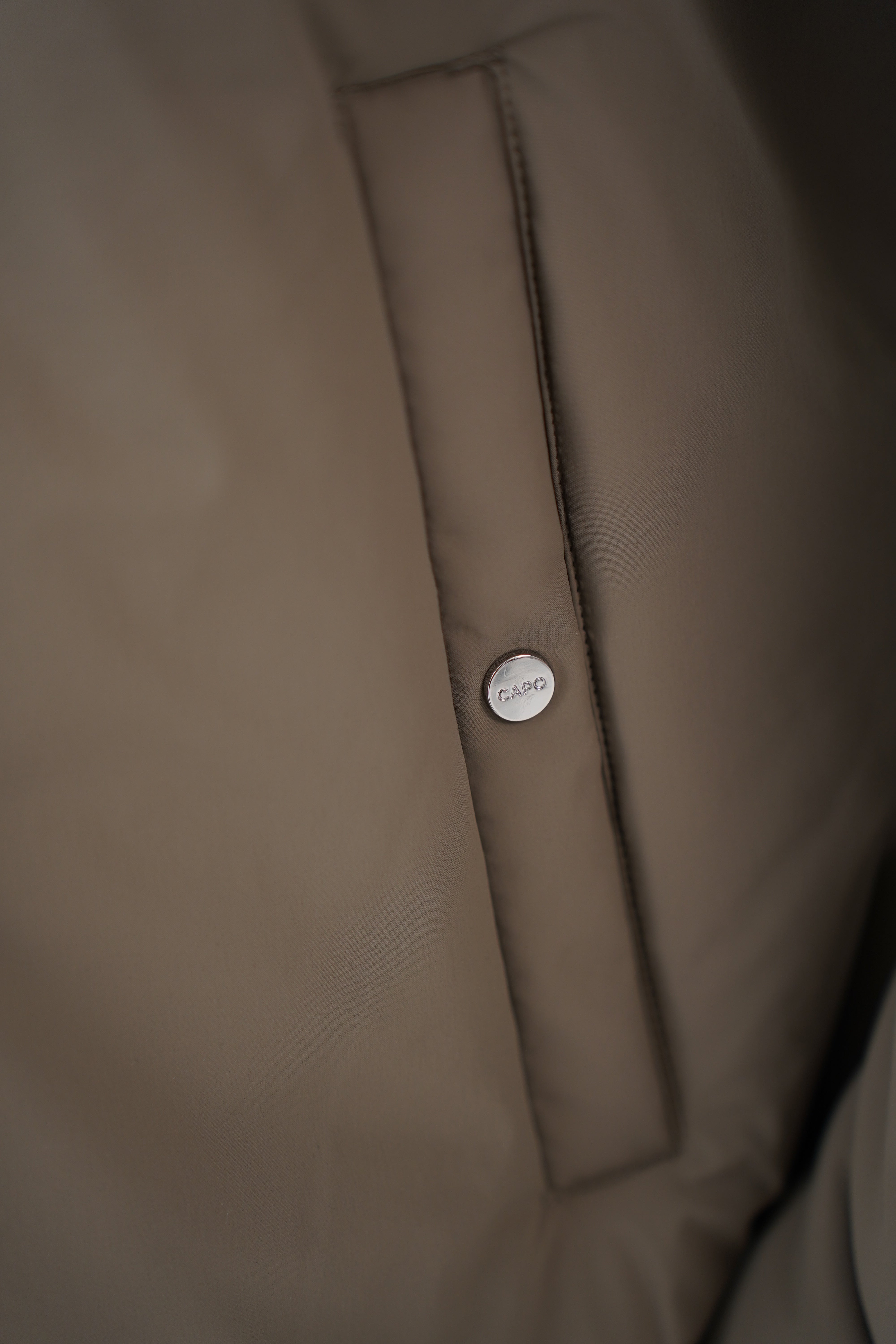 Detail pocket view of CAPO Padded Olive Bomber Jackets