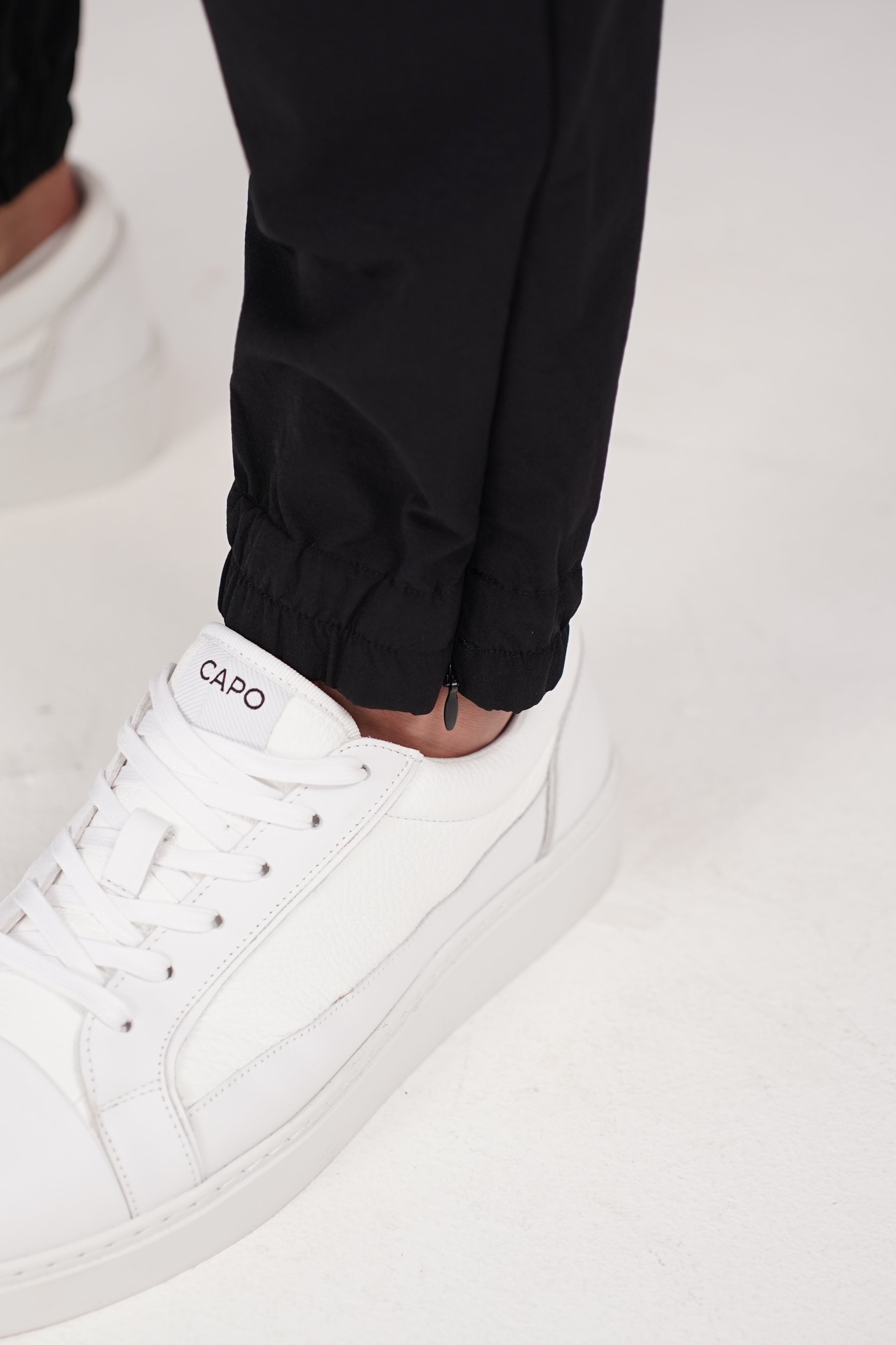 Detail view of CAPO Smart Cuffed Black Cargo Pants