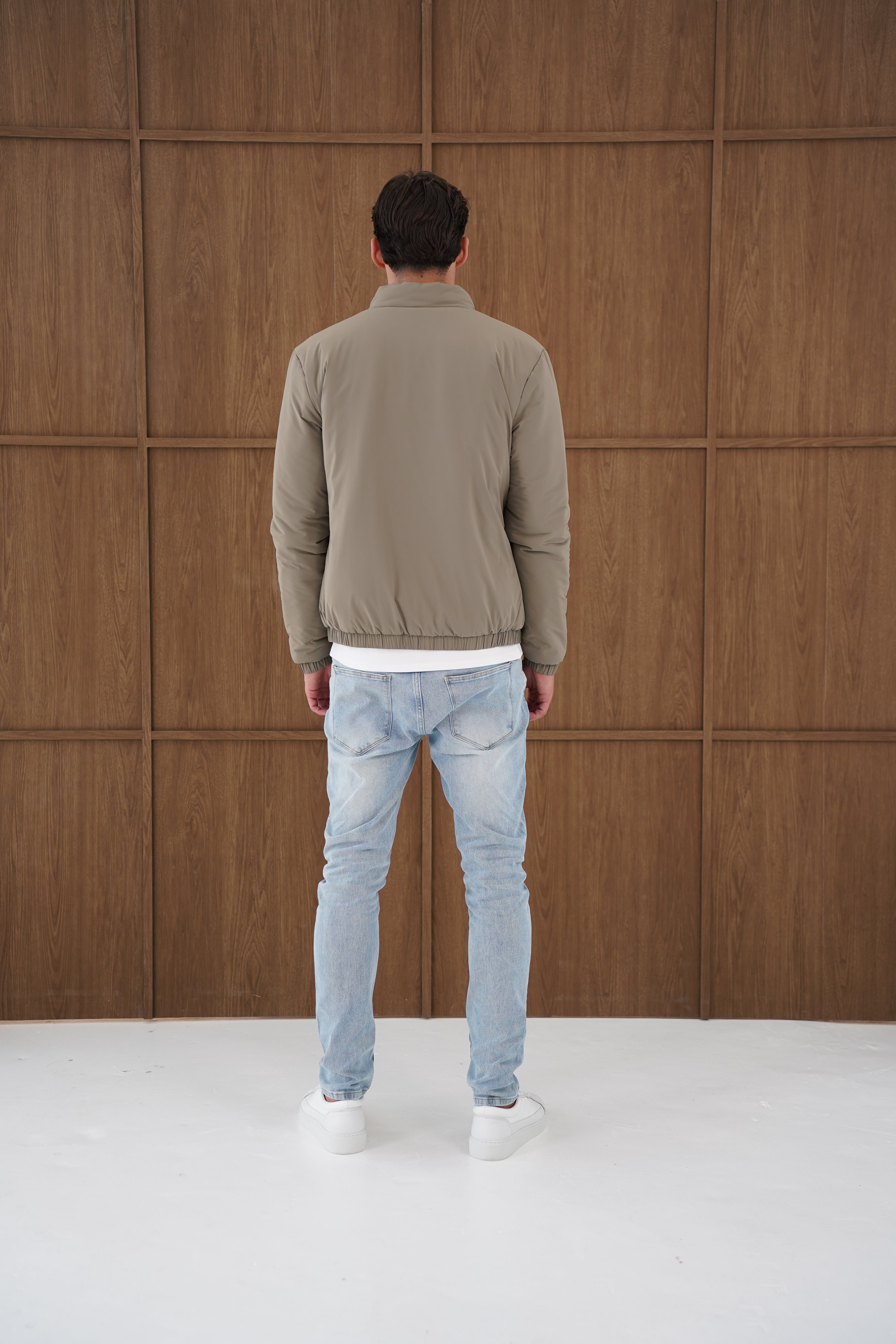 Model back view of CAPO Padded Olive Bomber Jackets