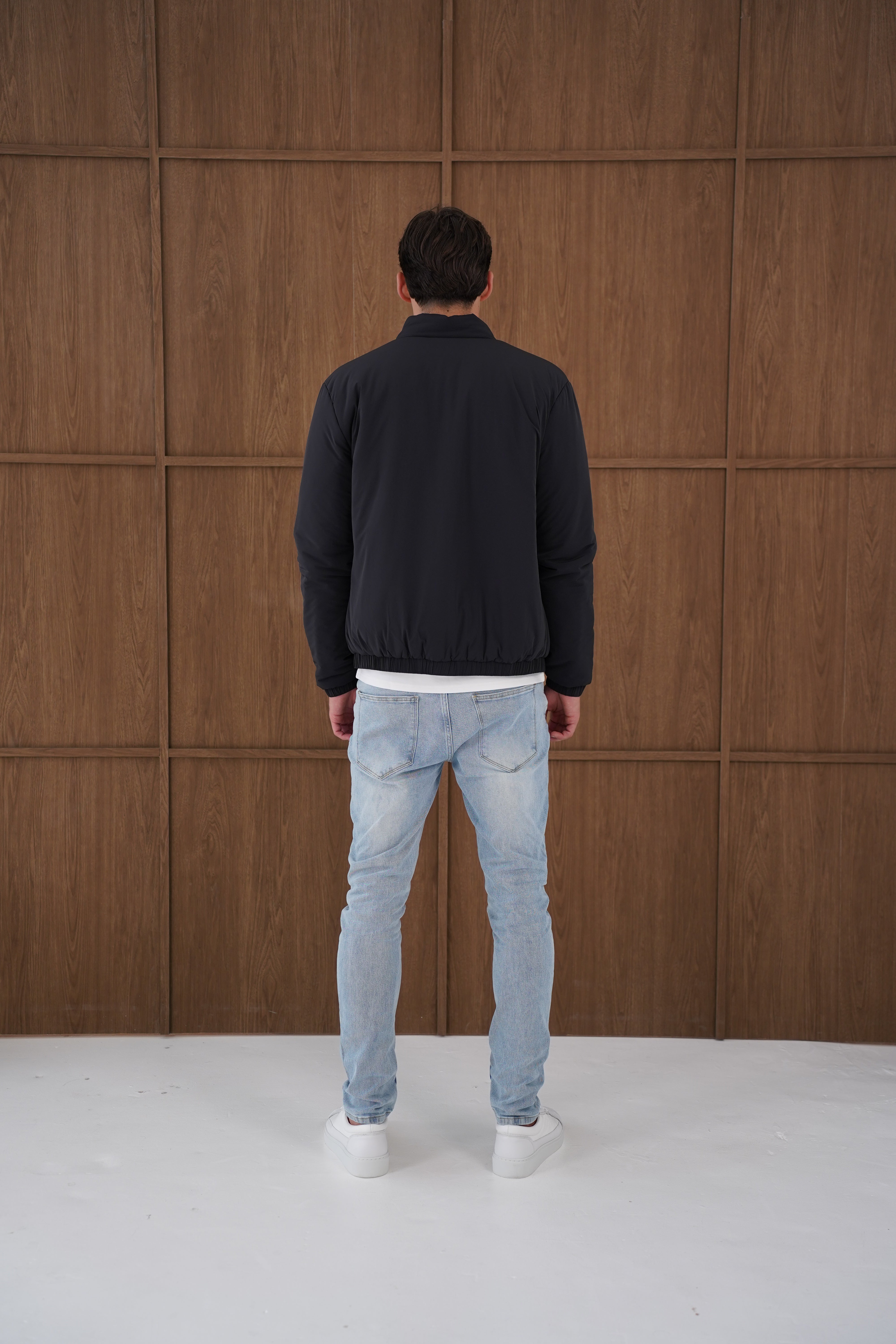 Model back view of CAPO Padded Bomber Black Jacket