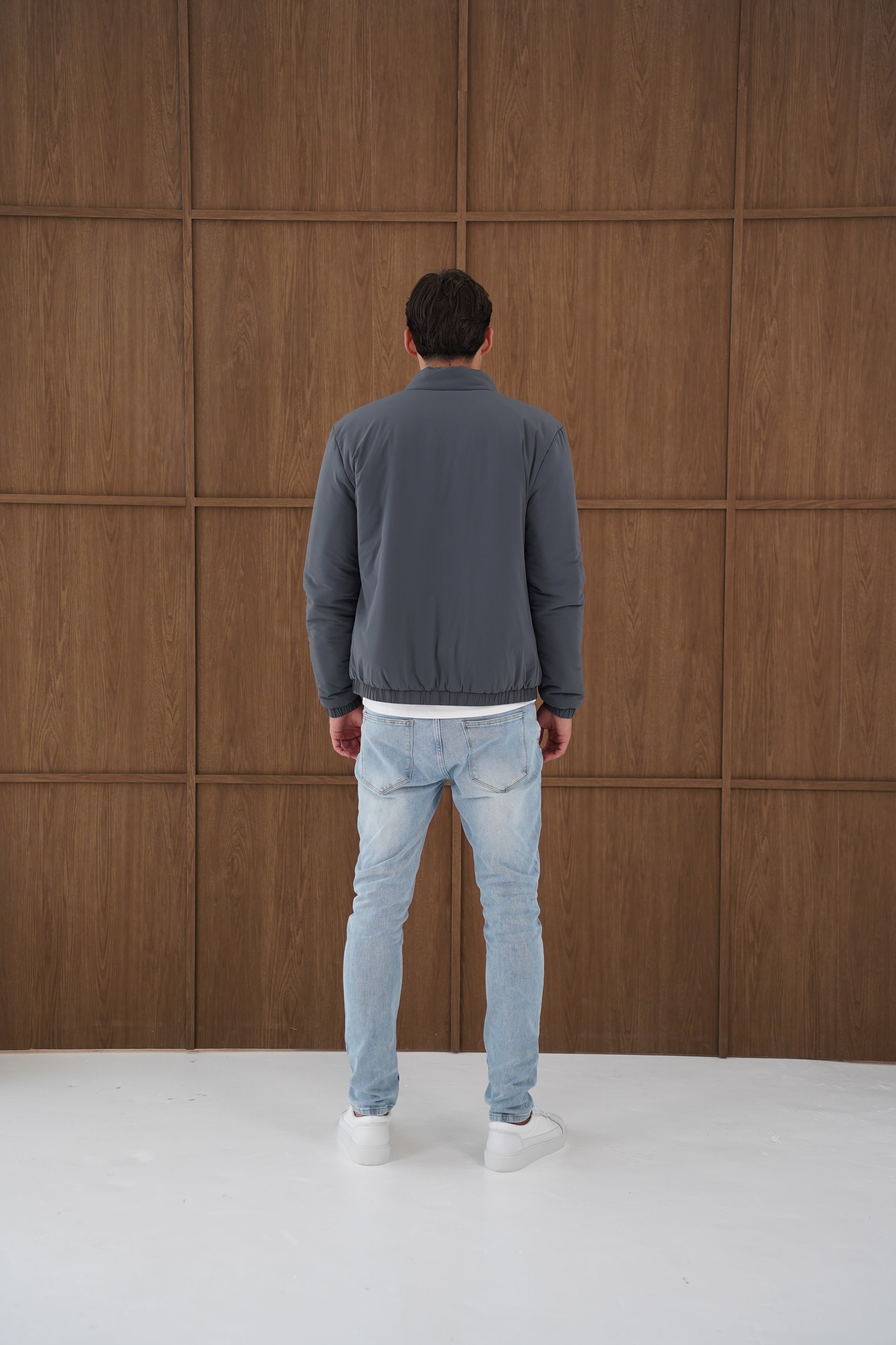 Model back view of CAPO Padded Bomber Charcoal Jacket