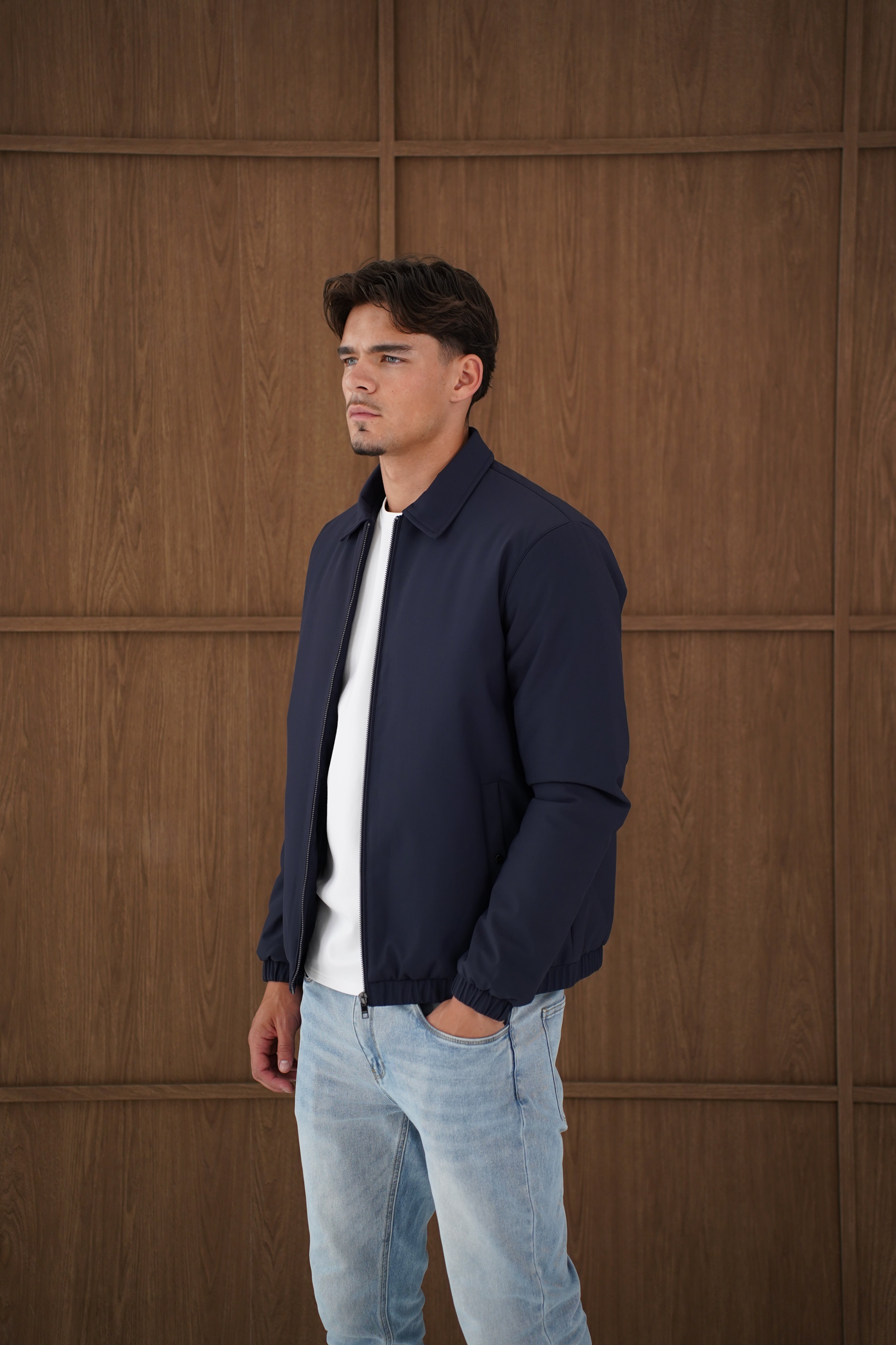 Model side view of CAPO Padded Collar Navy Jacket