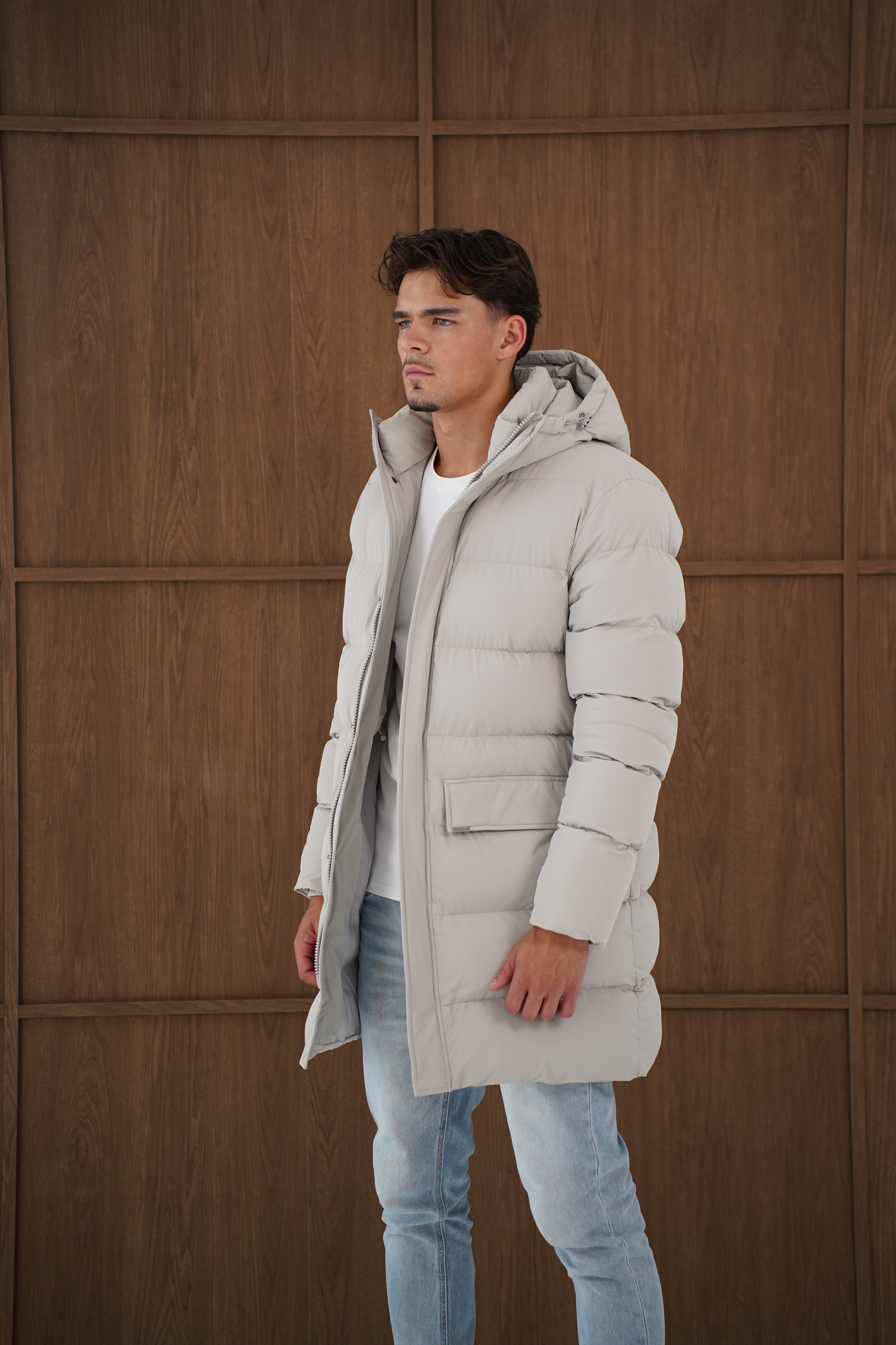 Model side view of CAPO Mid Length Stone Puffer Jacket