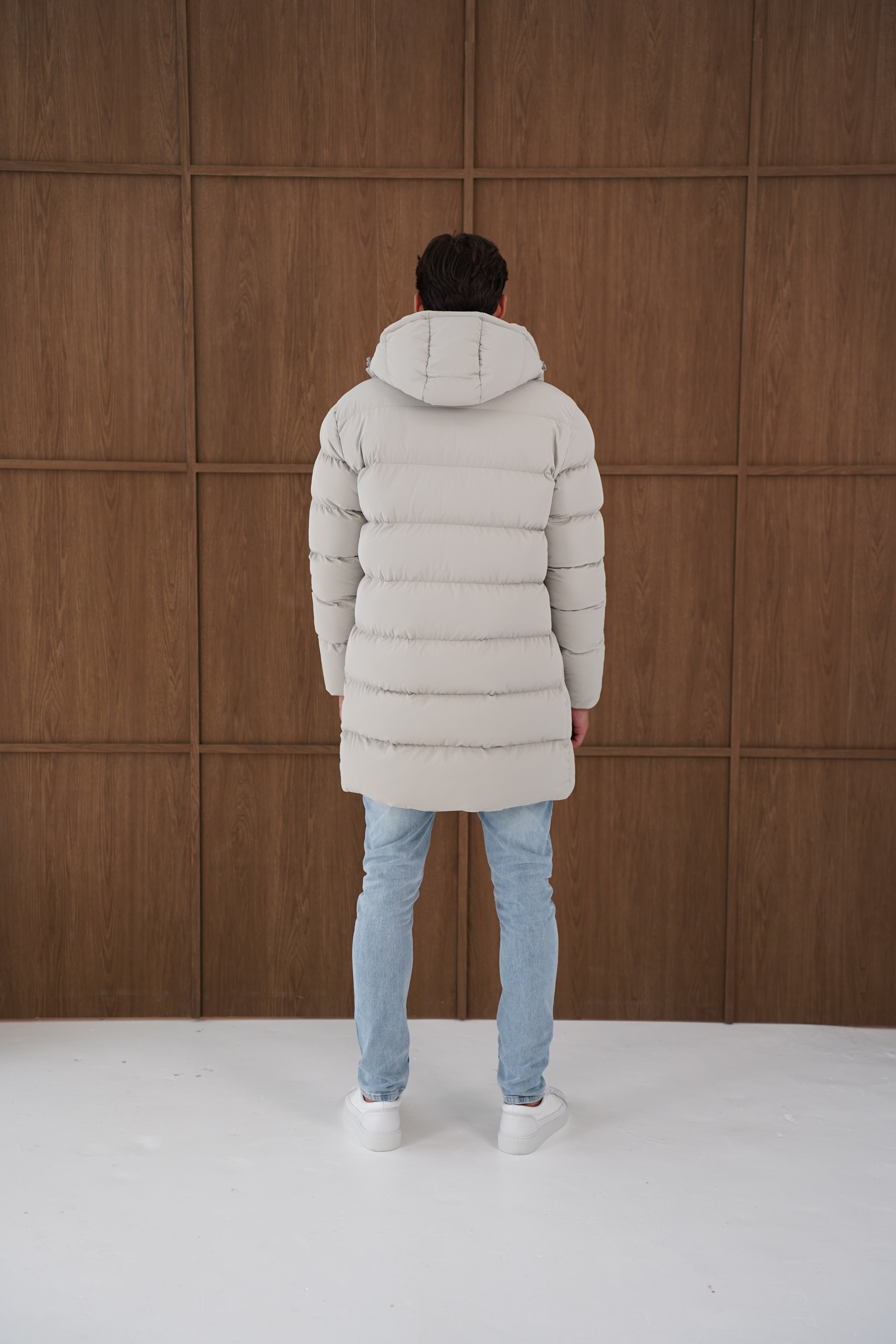 Model back view of CAPO Mid Length Stone Puffer Jacket