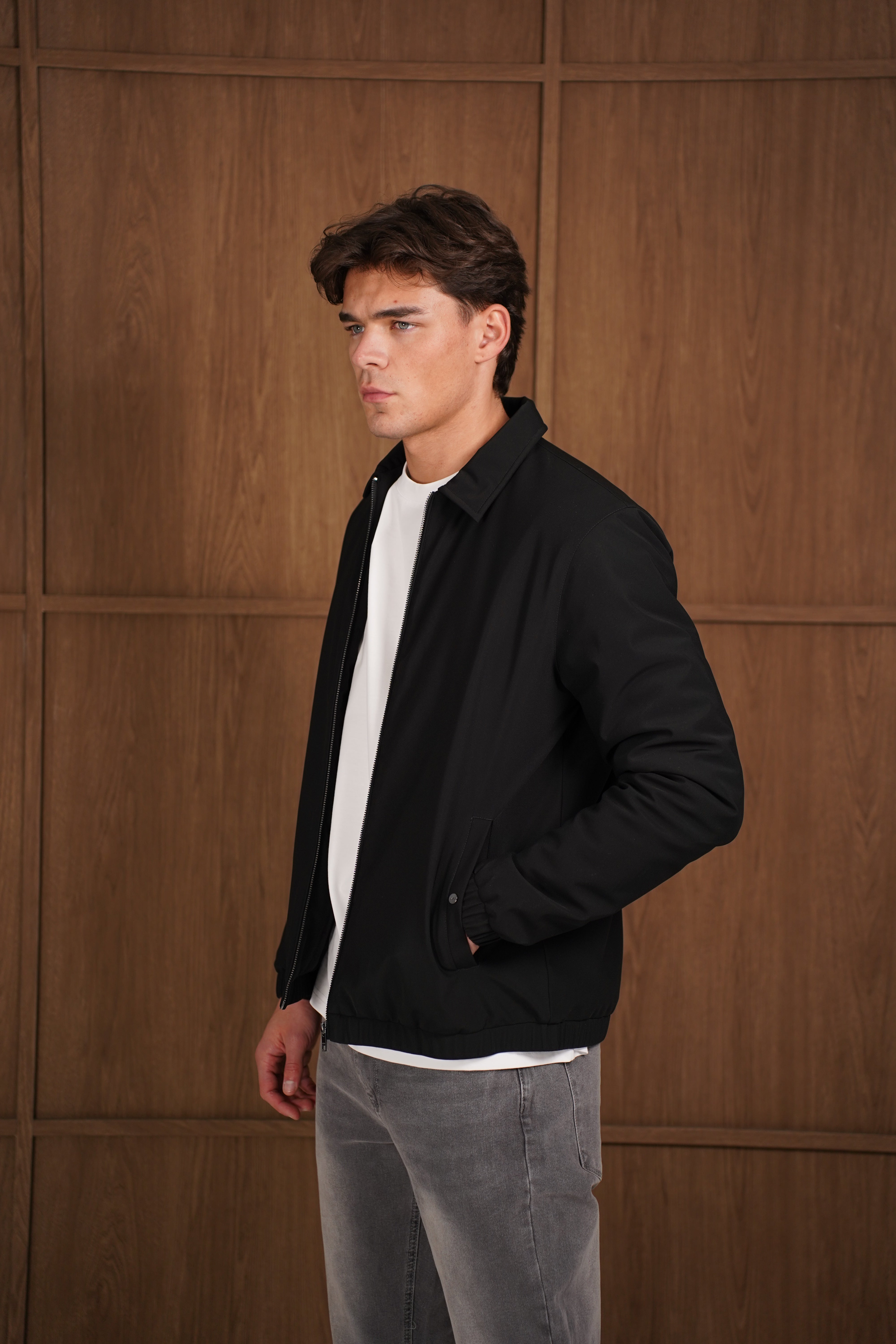 Model side view of CAPO Padded Collar Black Jacket