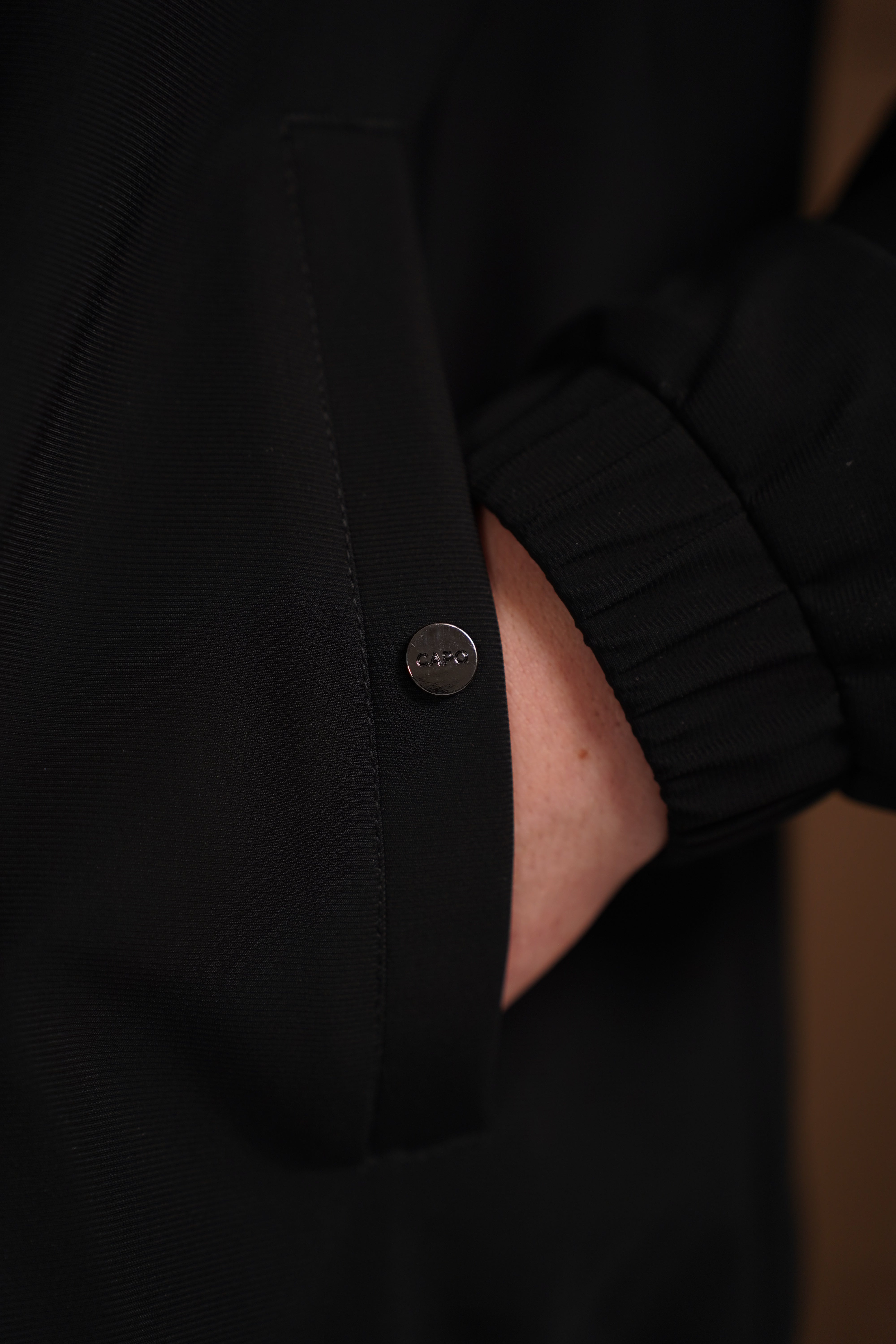 Detail pocket view of CAPO Padded Collar Black Jacket