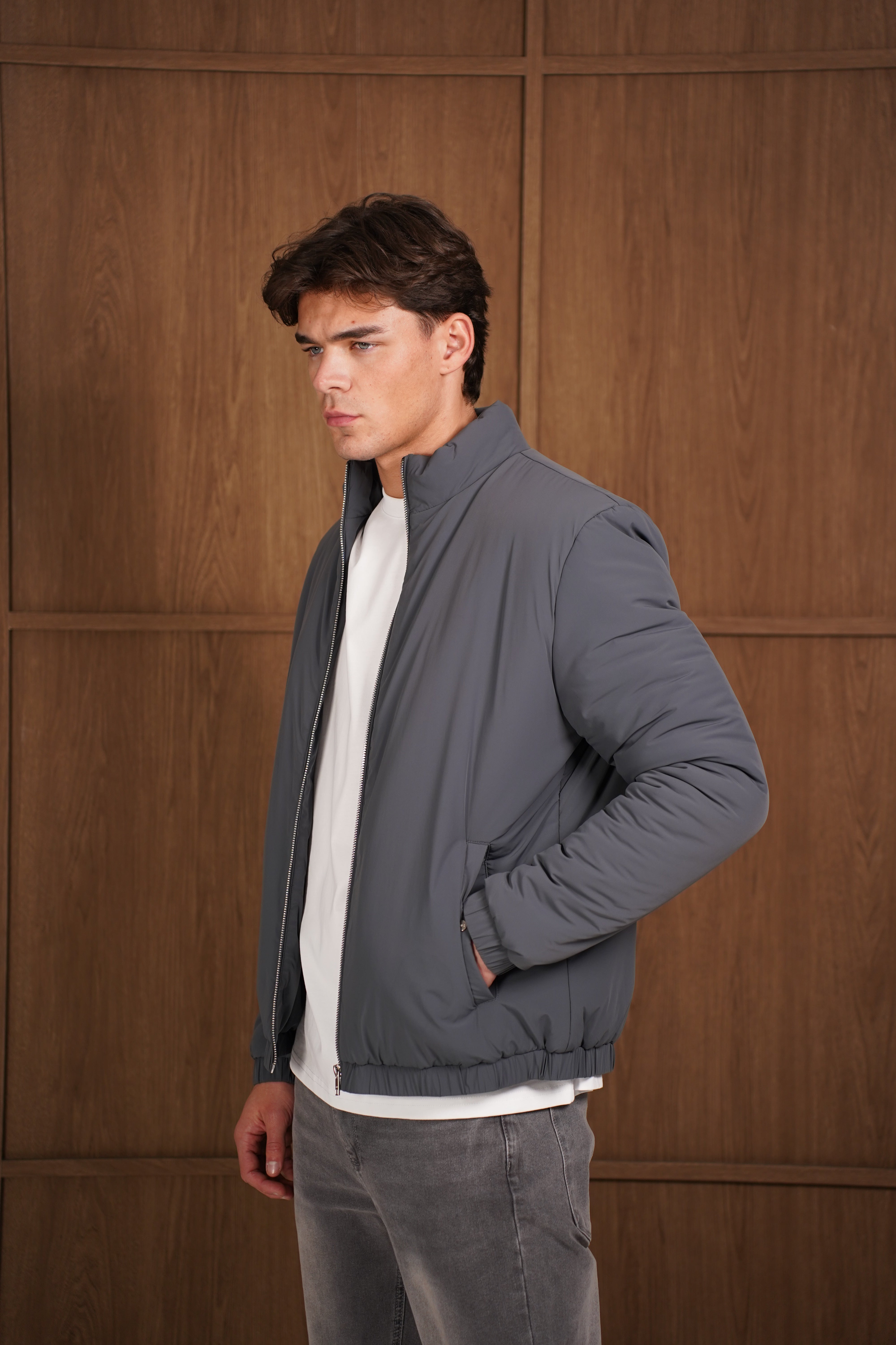 Model side view of CAPO Padded Bomber Charcoal Jacket
