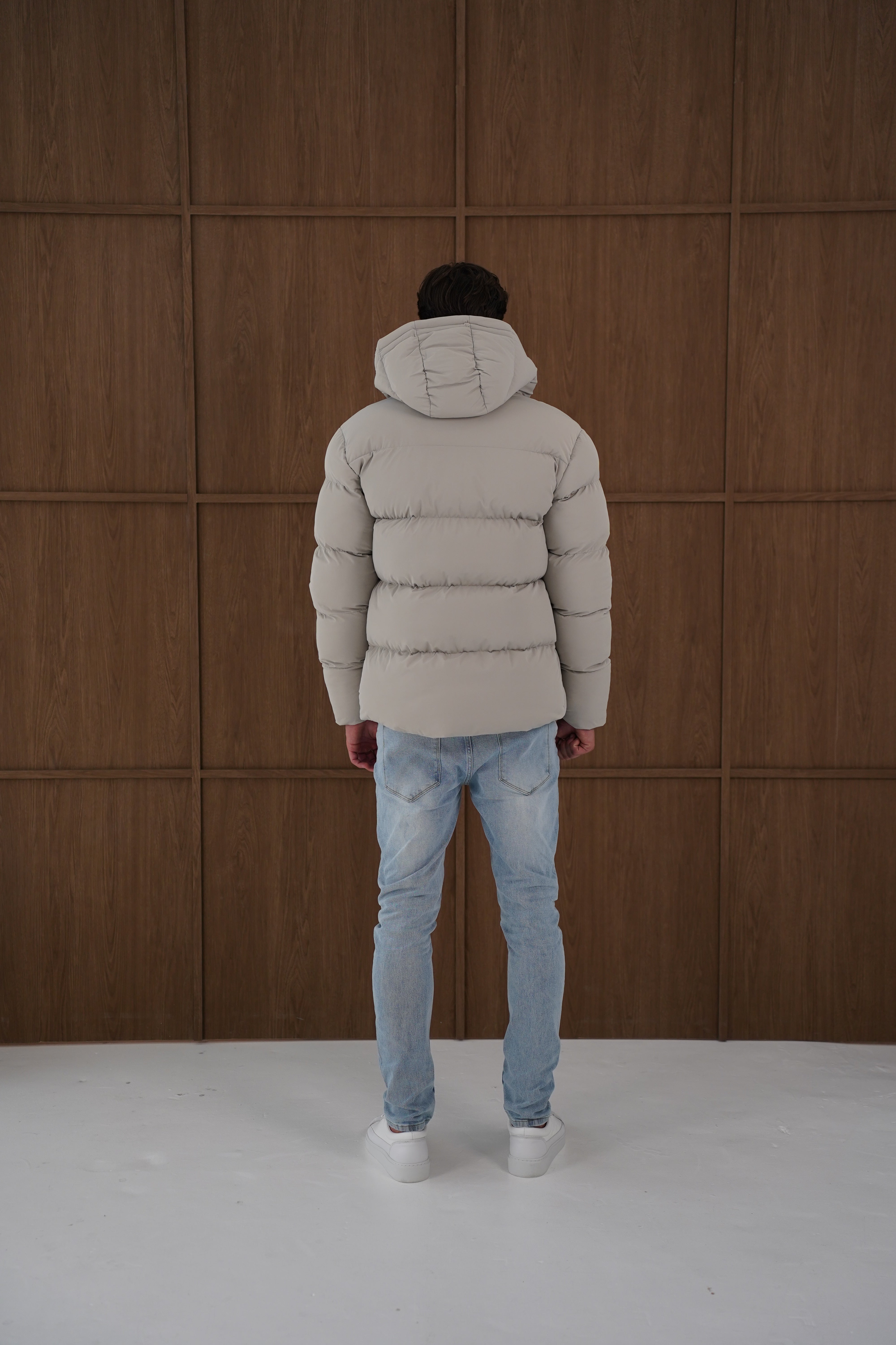 Model back view of CAPO Stone Puffer Jacket