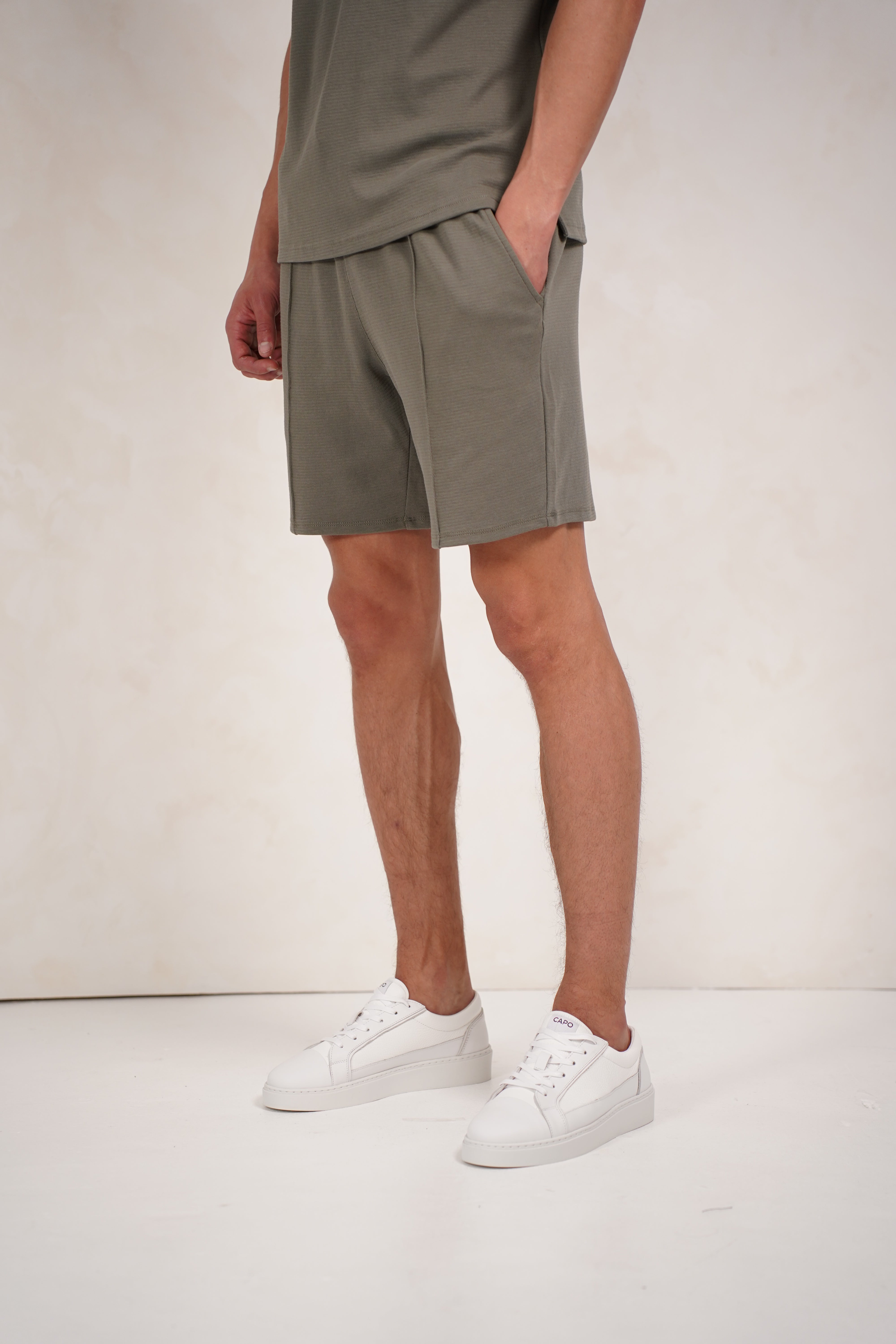 Side view of textured Light Olive Shorts