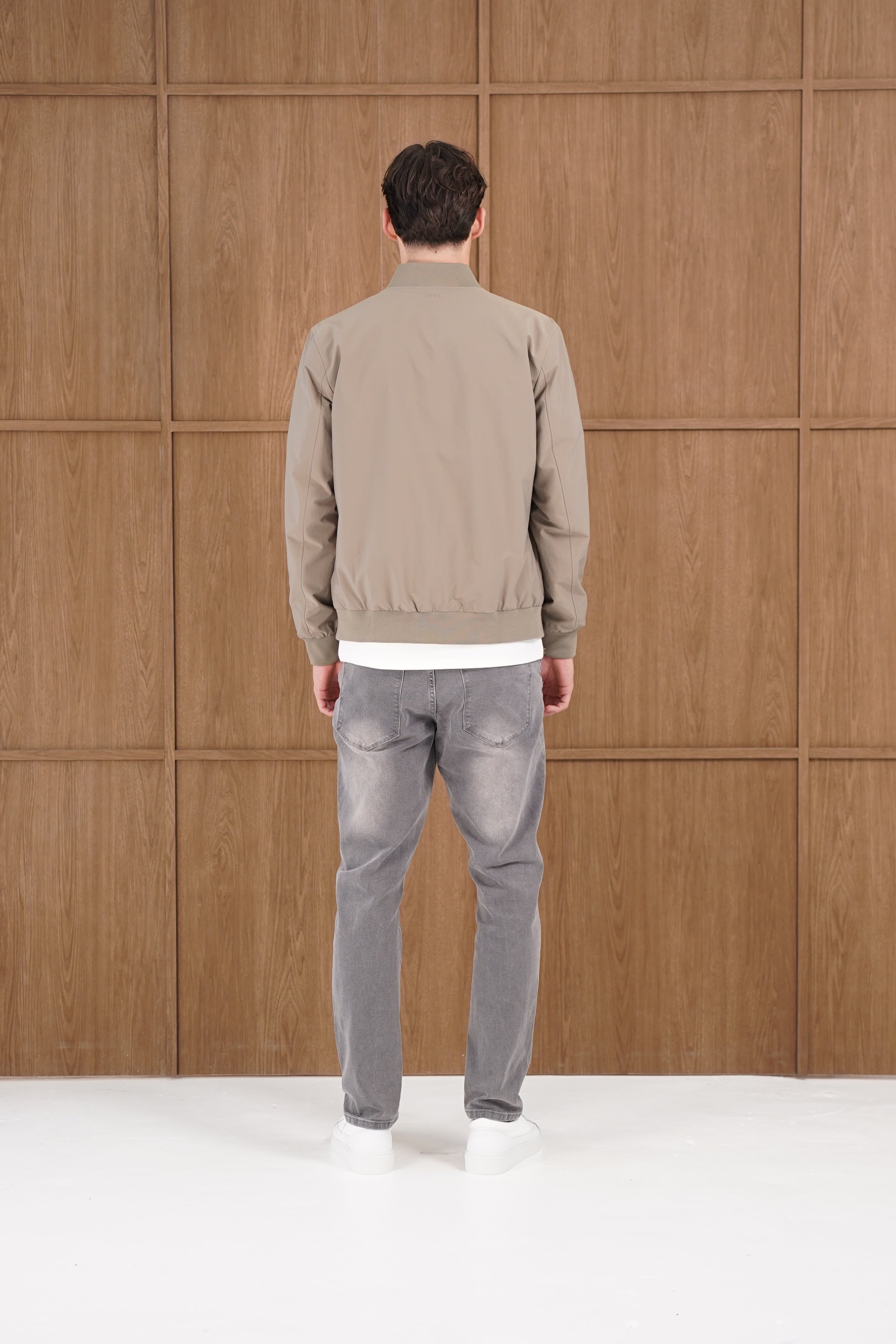 Model back view of CAPO Light Olive Bomber Jacket