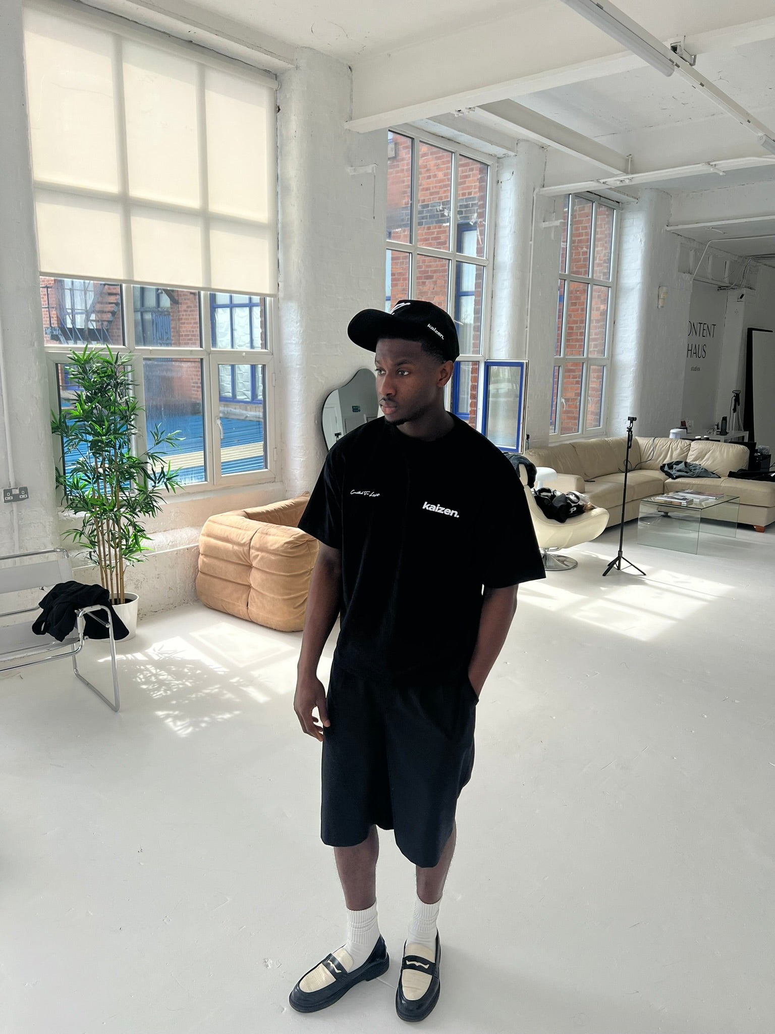 Model view of Kaizen Market Arch Tee Black T-shirt