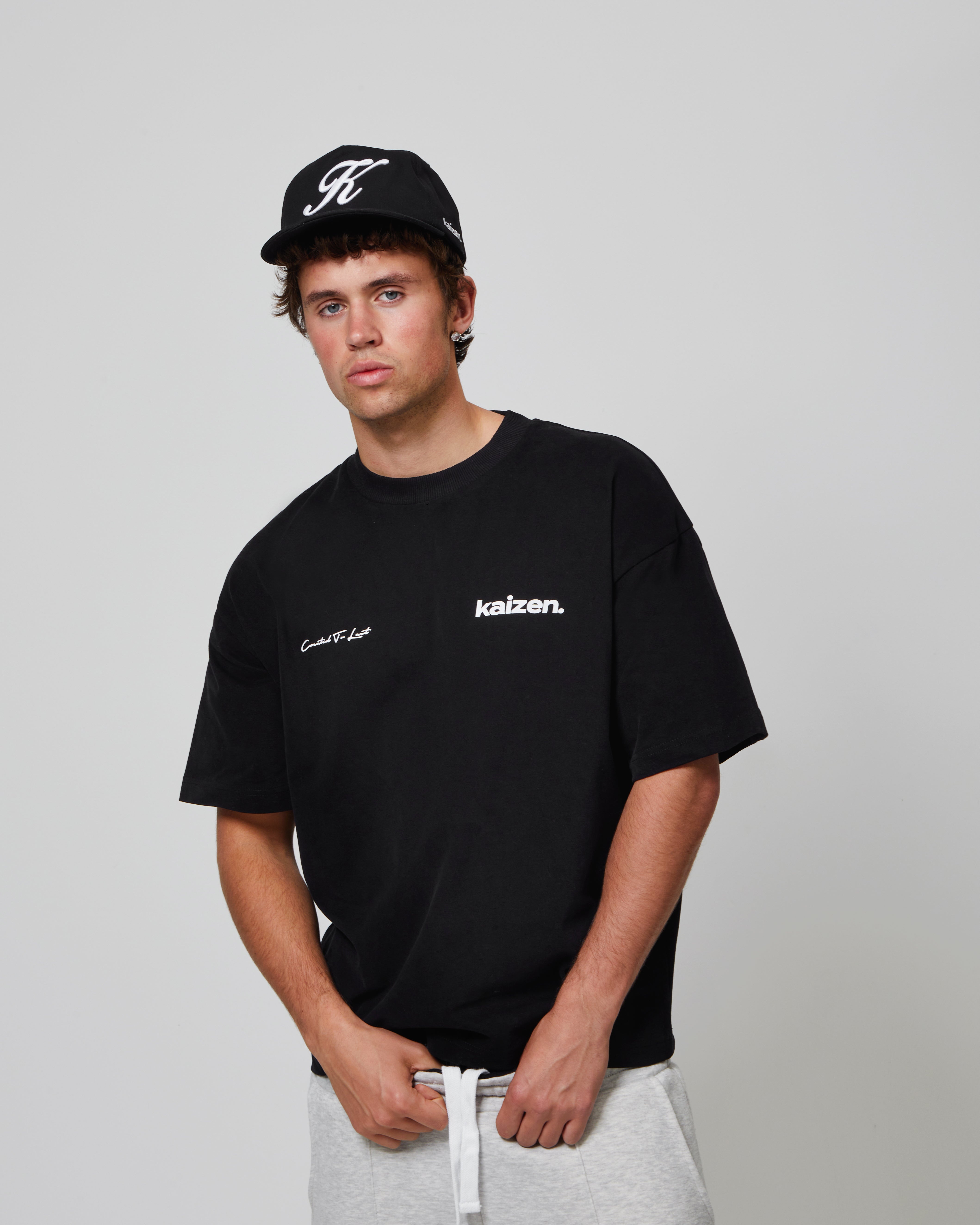 Model view of Kaizen Market Arch Tee Black T-shirt