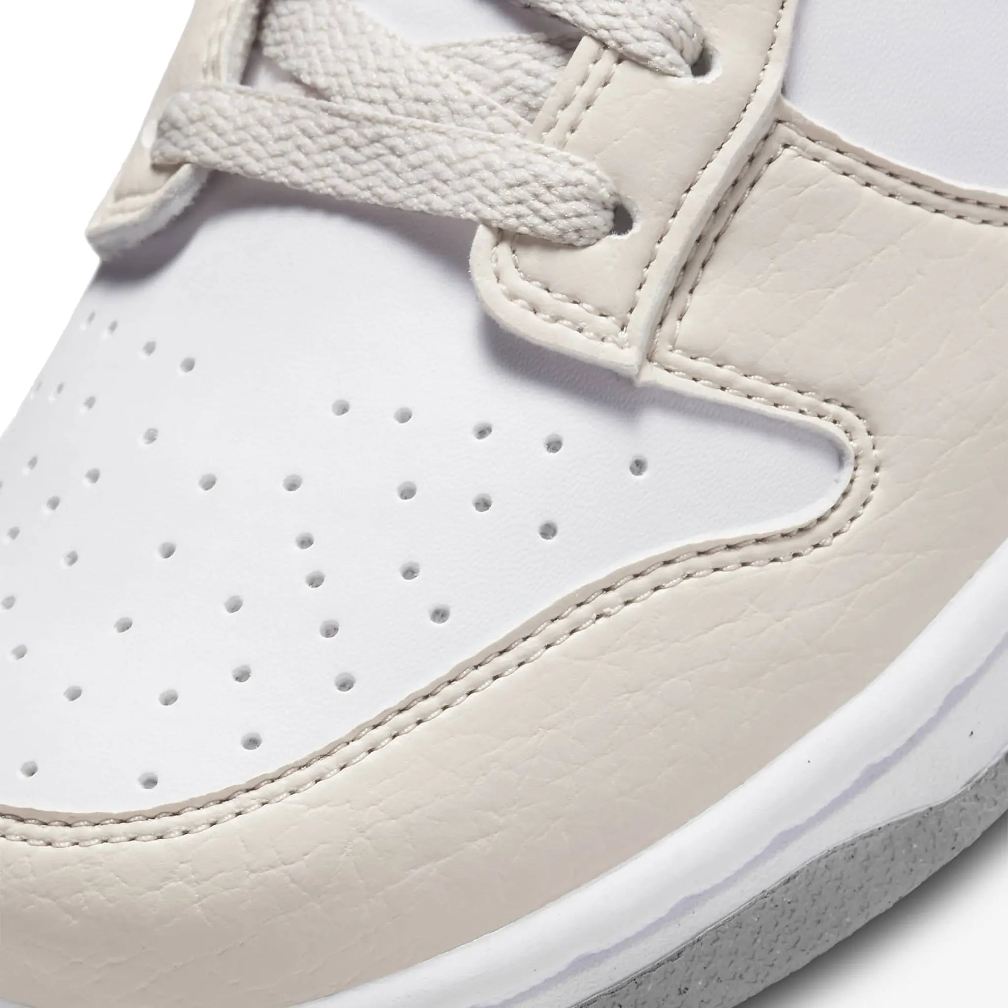 Toe view of Nike Dunk Low Next Nature White Light Orewood Brown (W)