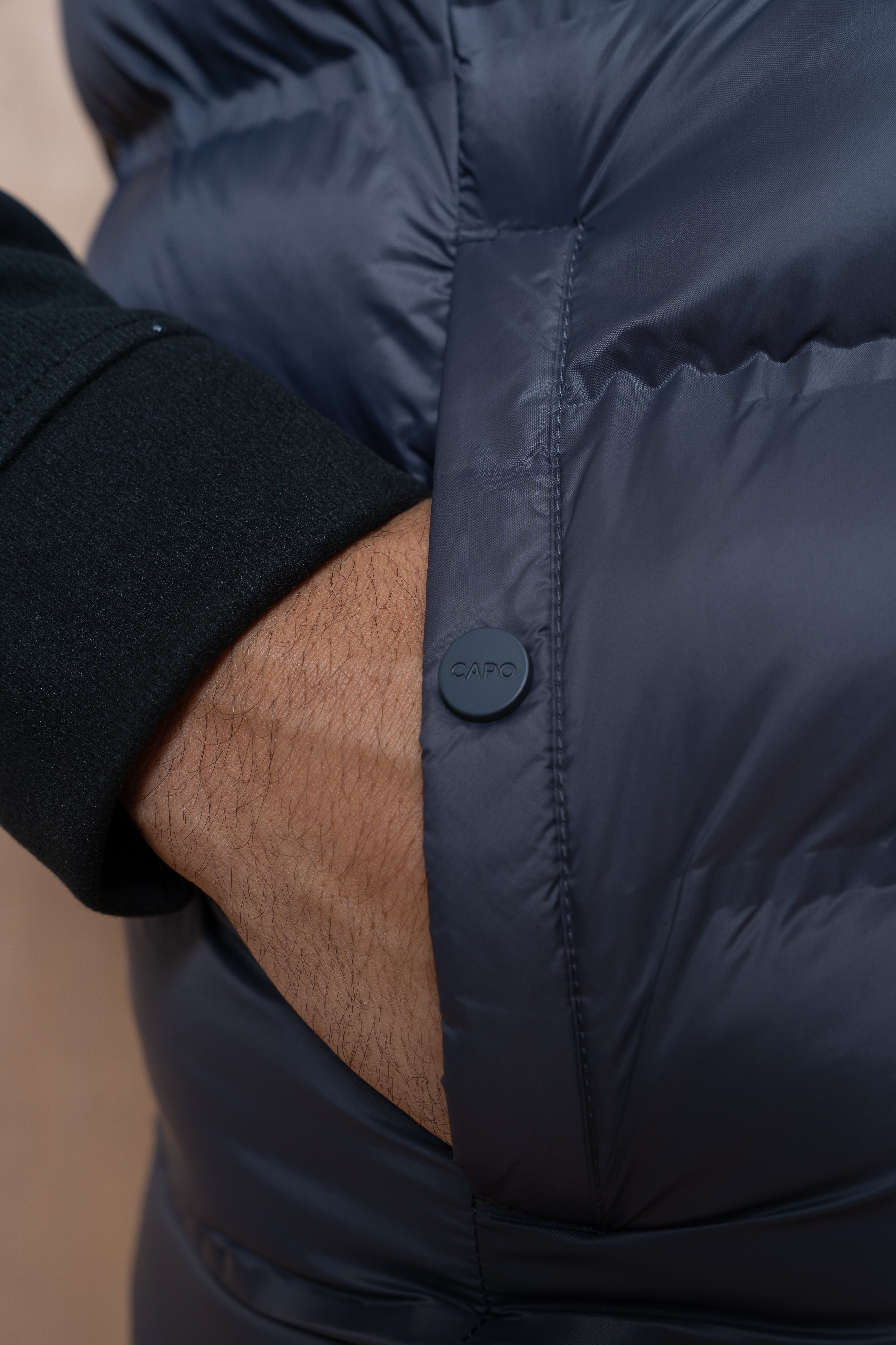 Pocket view of CAPO Tech Asphalt Puffer Gilet
