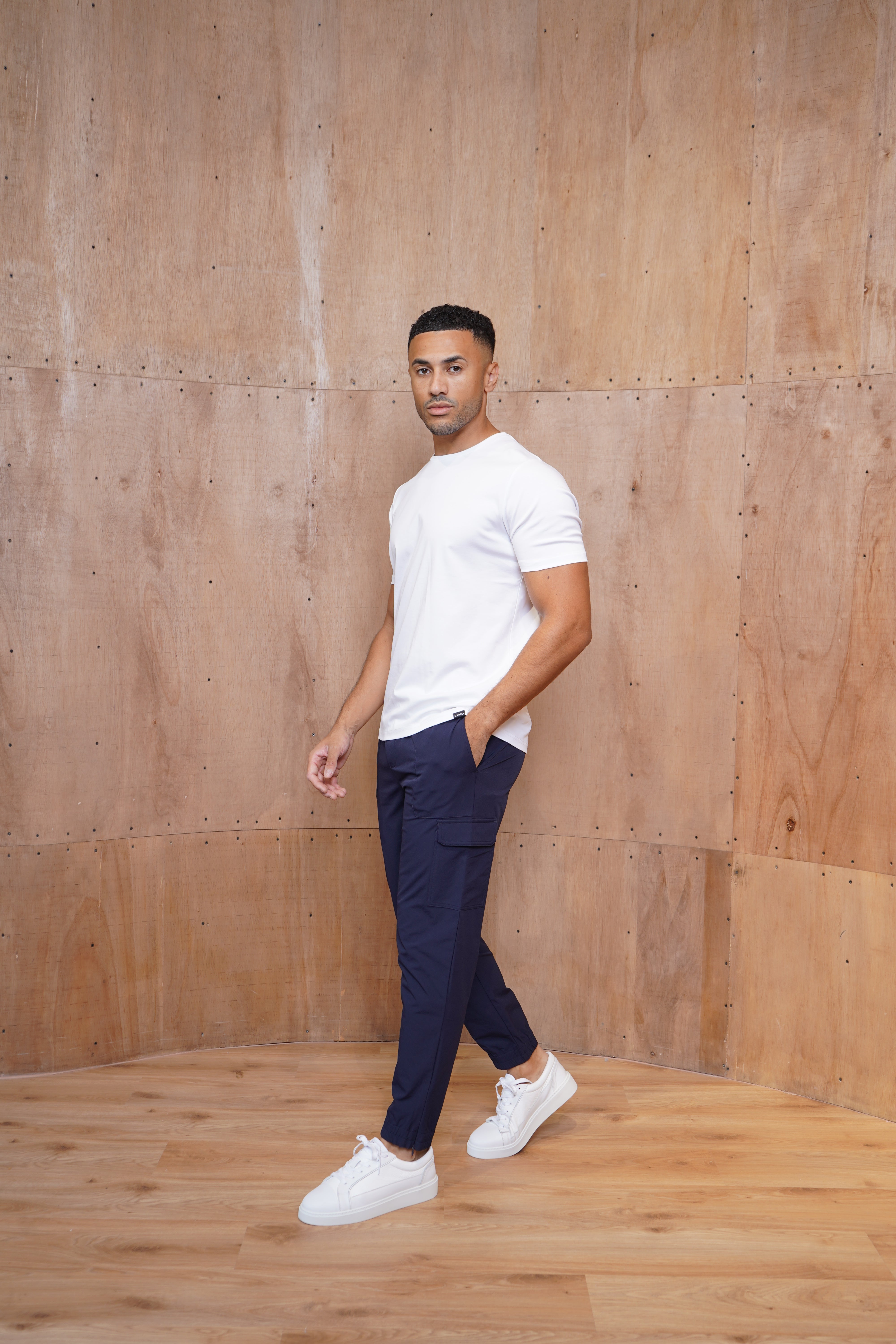 Model view of CAPO Smart Cuffed Navy Cargo Pants