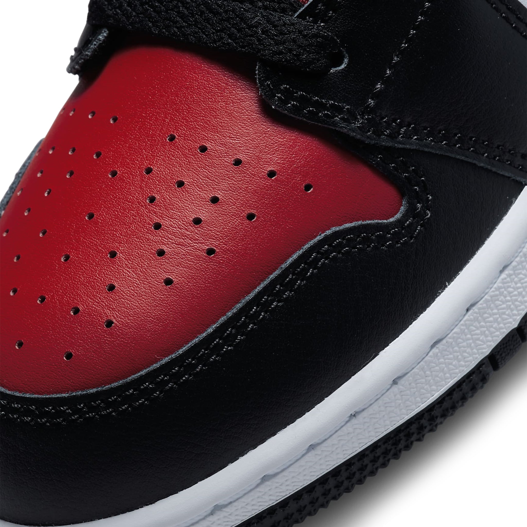 Toe box view of Air Jordan 1 Mid Black Fire Red (GS) 554725-079