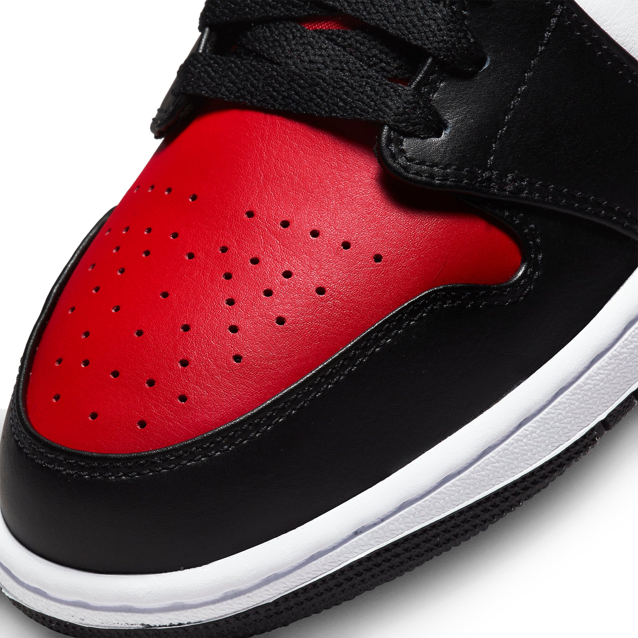 Toe box view of Air Jordan 1 Mid White Black Red (2022) 554724-079