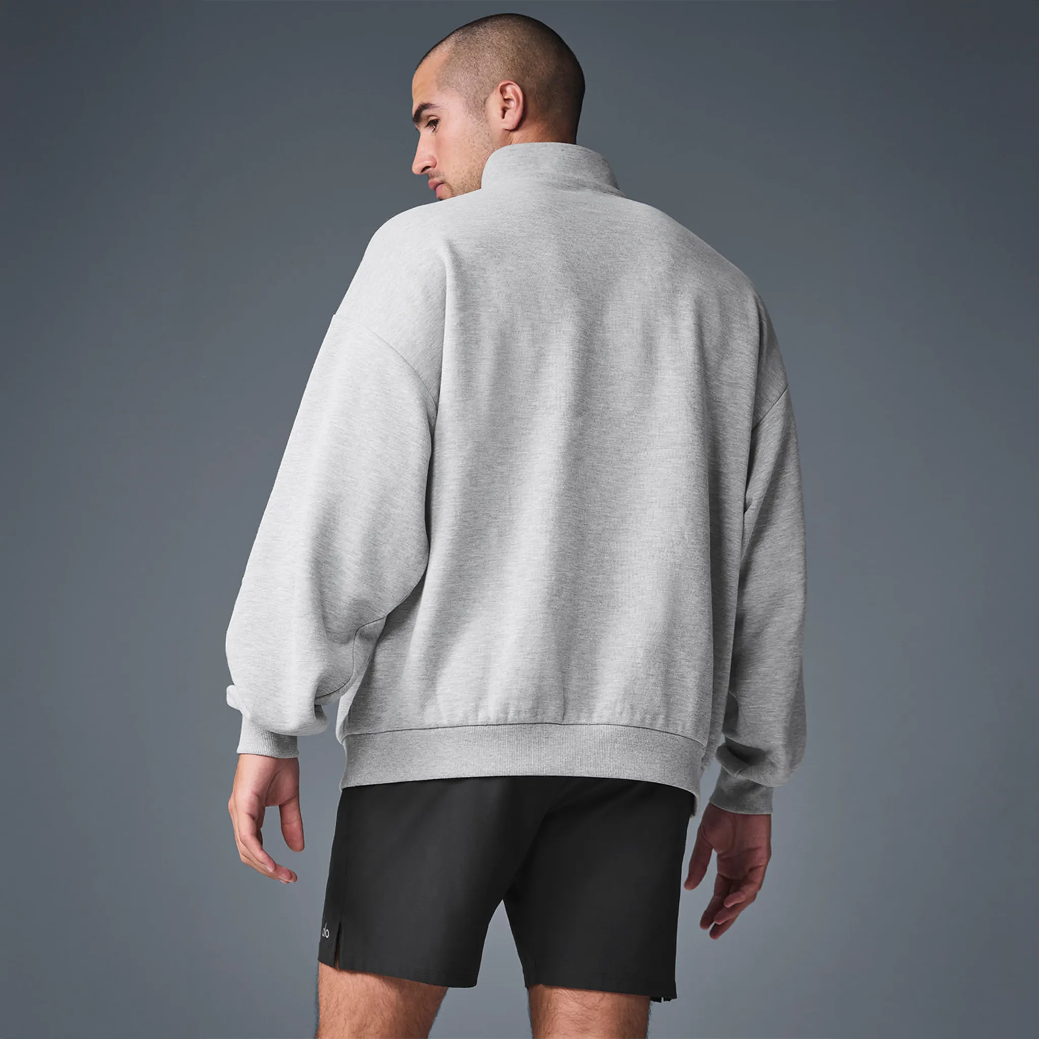 Back View of Alo Yoga Accolade 1/4 Zip Athletic Heather Grey Sweatshirt