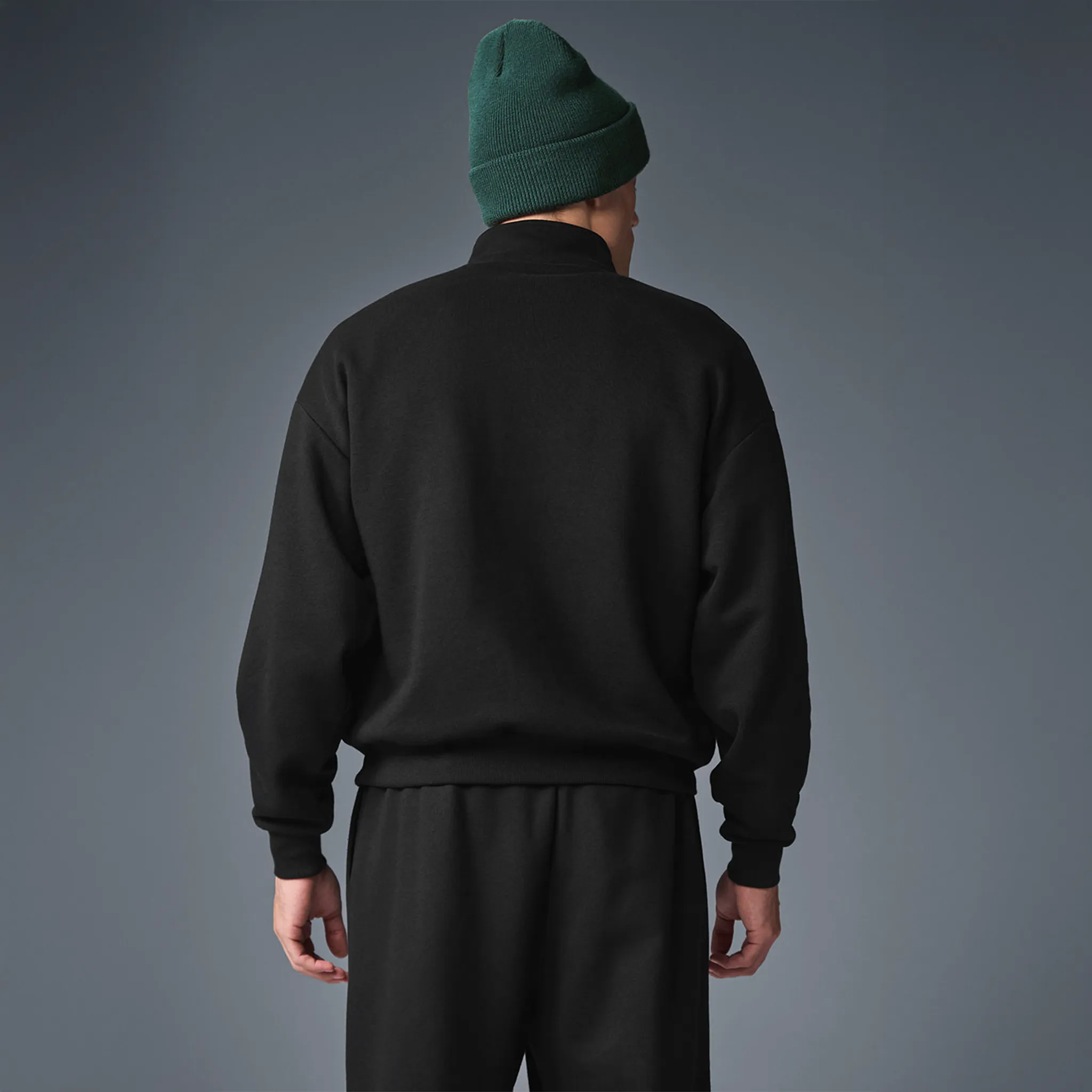 Back View of Alo Yoga Accolade 1/4 Zip Black Sweatshirt