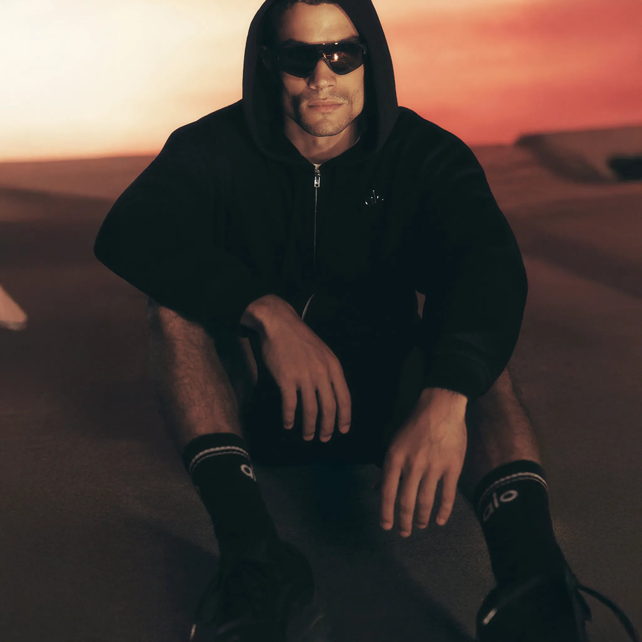 Model Side View of Alo Yoga Accolade Black Zip-Up Hoodie