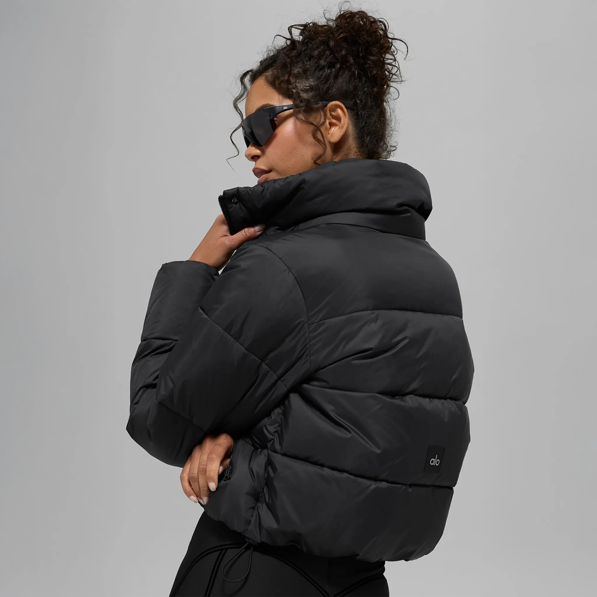 Back View of Alo Yoga Gold Rush Black Puffer Jacket (W)