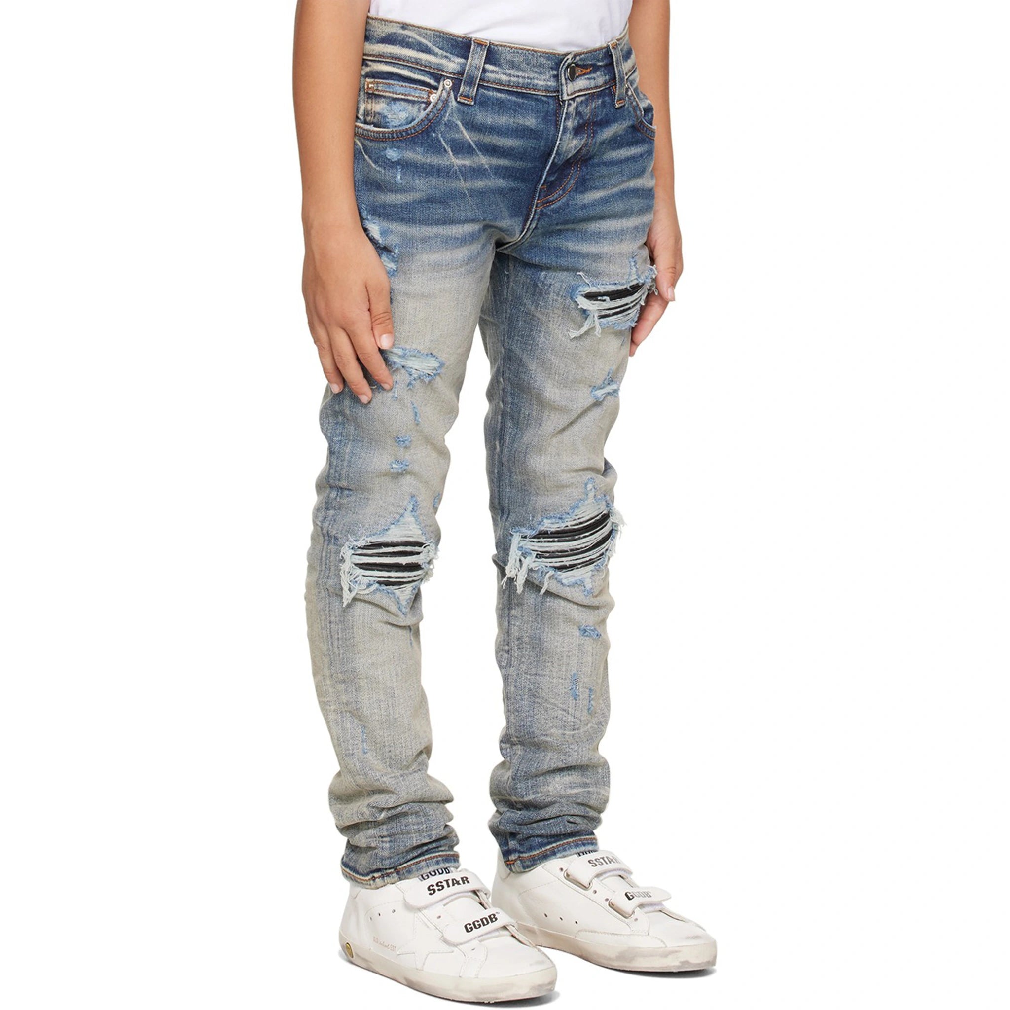 Model sode view of Amiri Kids MX1 Clay Indigo Jeans PF22KDS034-408